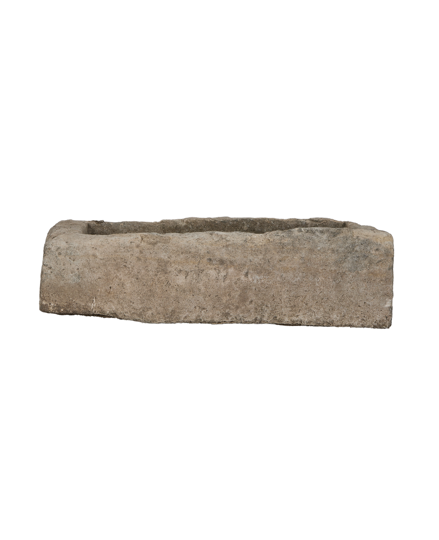 Vintage Indonesian limestone trough, rectangular, rough textured surface with slight chip in rim.