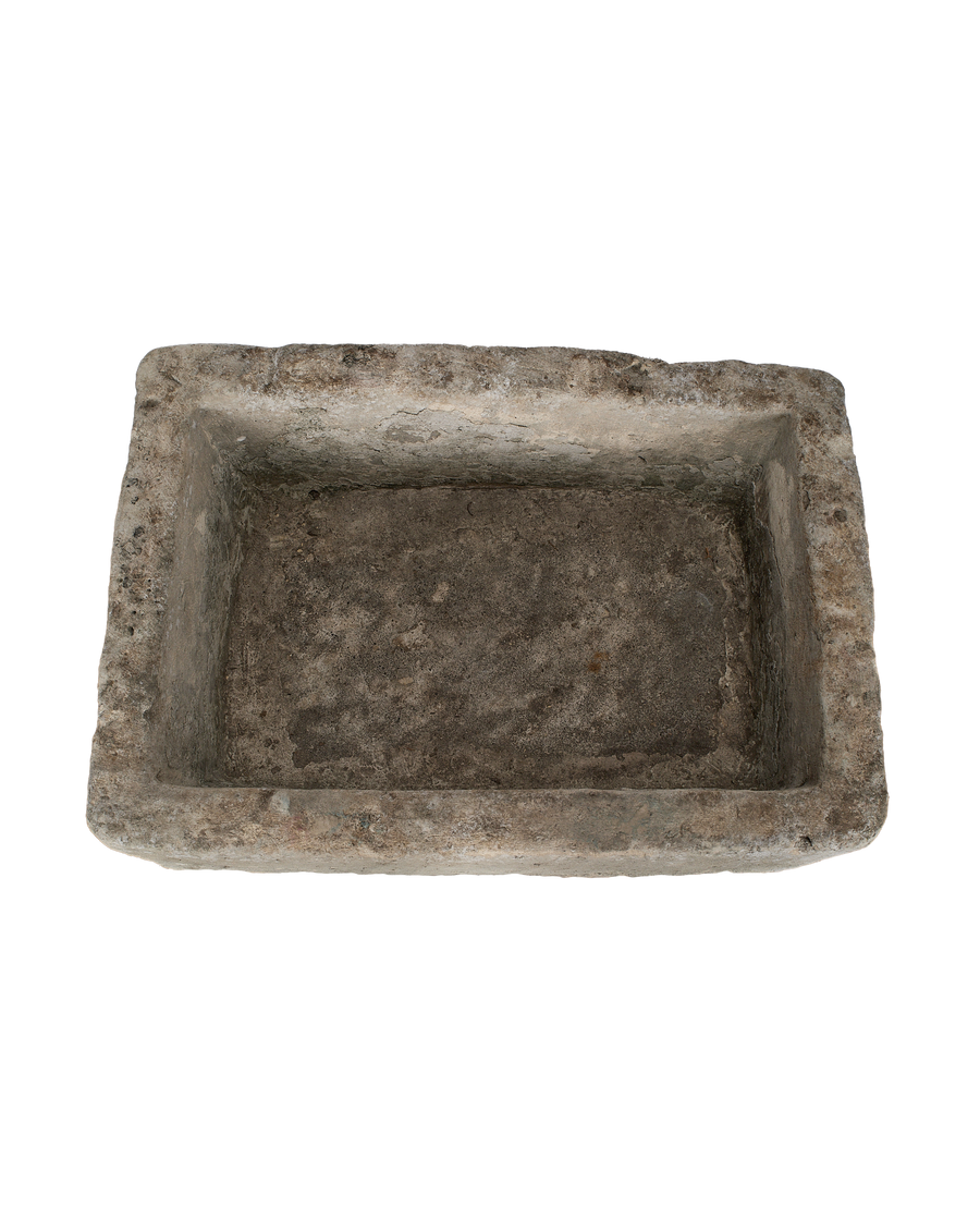 Vintage limestone rectangular trough from Indonesia, viewed looking into its weathered, textured interior.