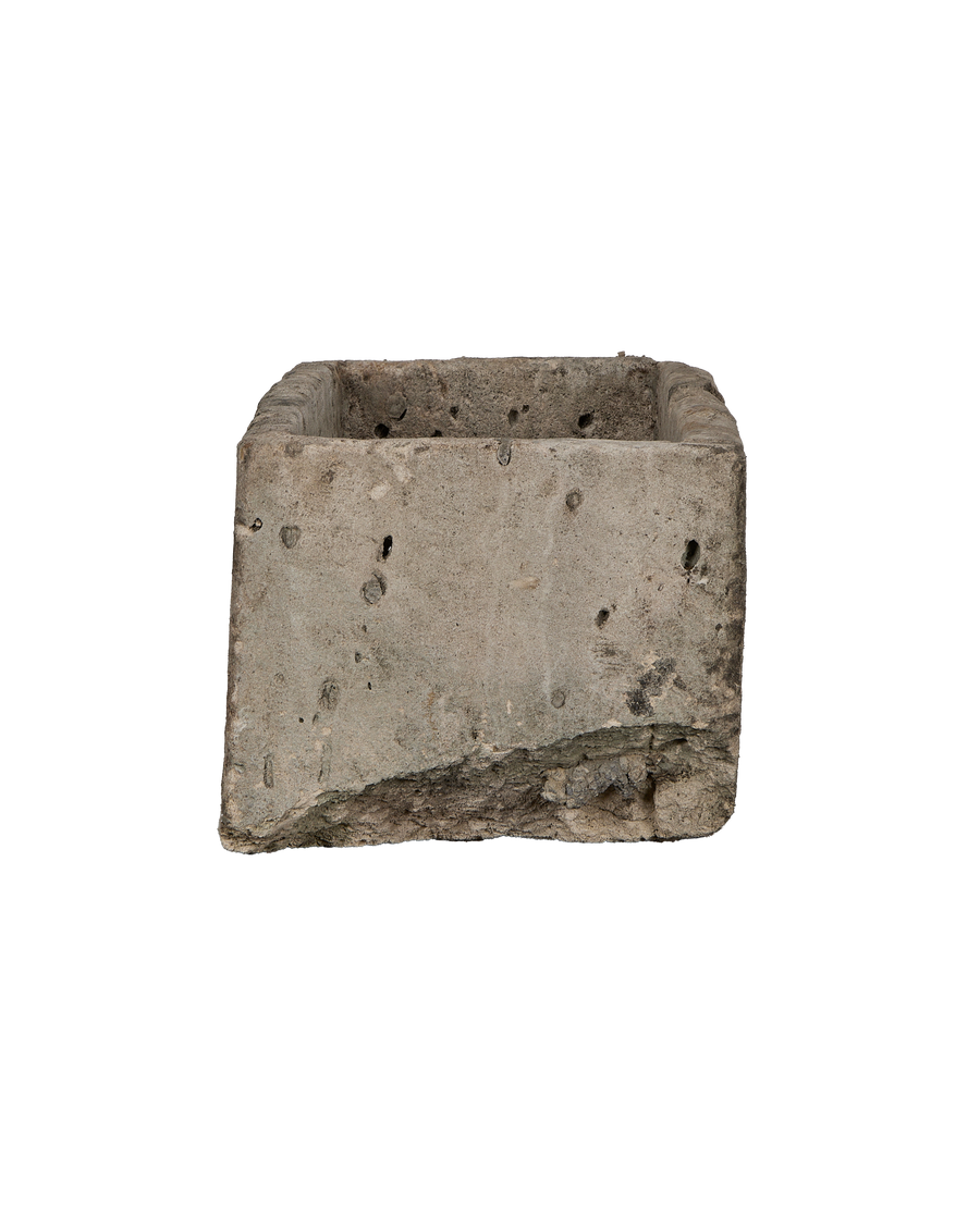 Vintage limestone rectangular trough, showing rough side texture and weathered patina.