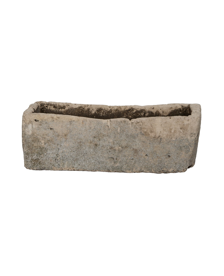 Vintage Indonesian limestone garden trough with weathered texture from front angle.
