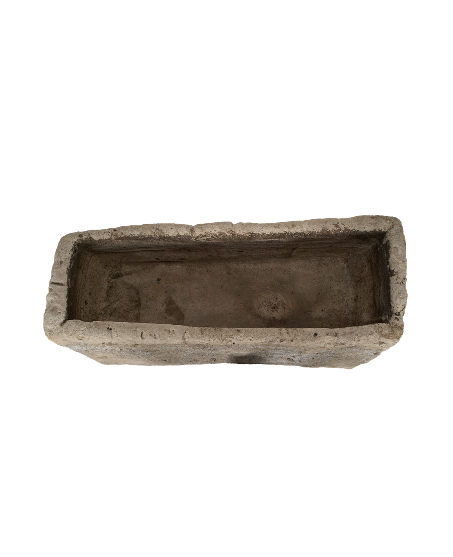 Vintage Indonesian rectangular limestone trough, top-down view showing interior depth and rough-hewn texture.