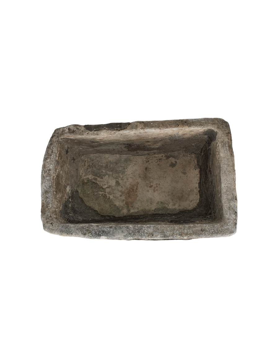 Vintage Indonesian rectagular limestone trough, top-down view showing interior patina and worn edges.
