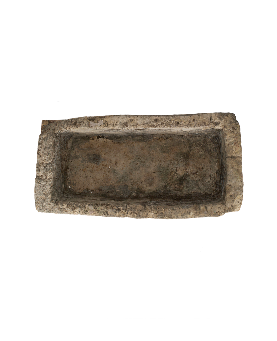 Vintage Indonesian rectangular limestone trough, rustic texture, dark interior, showing complete top view.