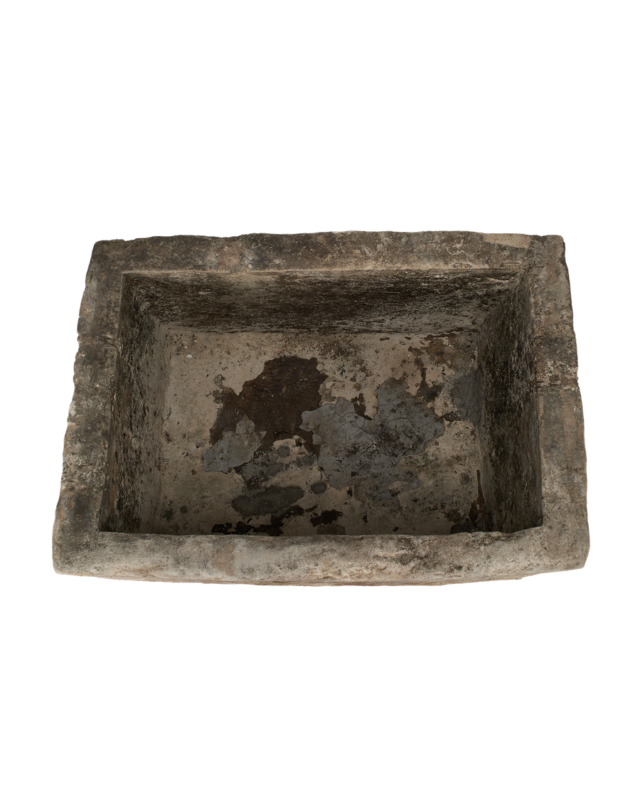 Vintage Indonesian rectangular limestone trough, top view revealing weathered interior patina and texture.