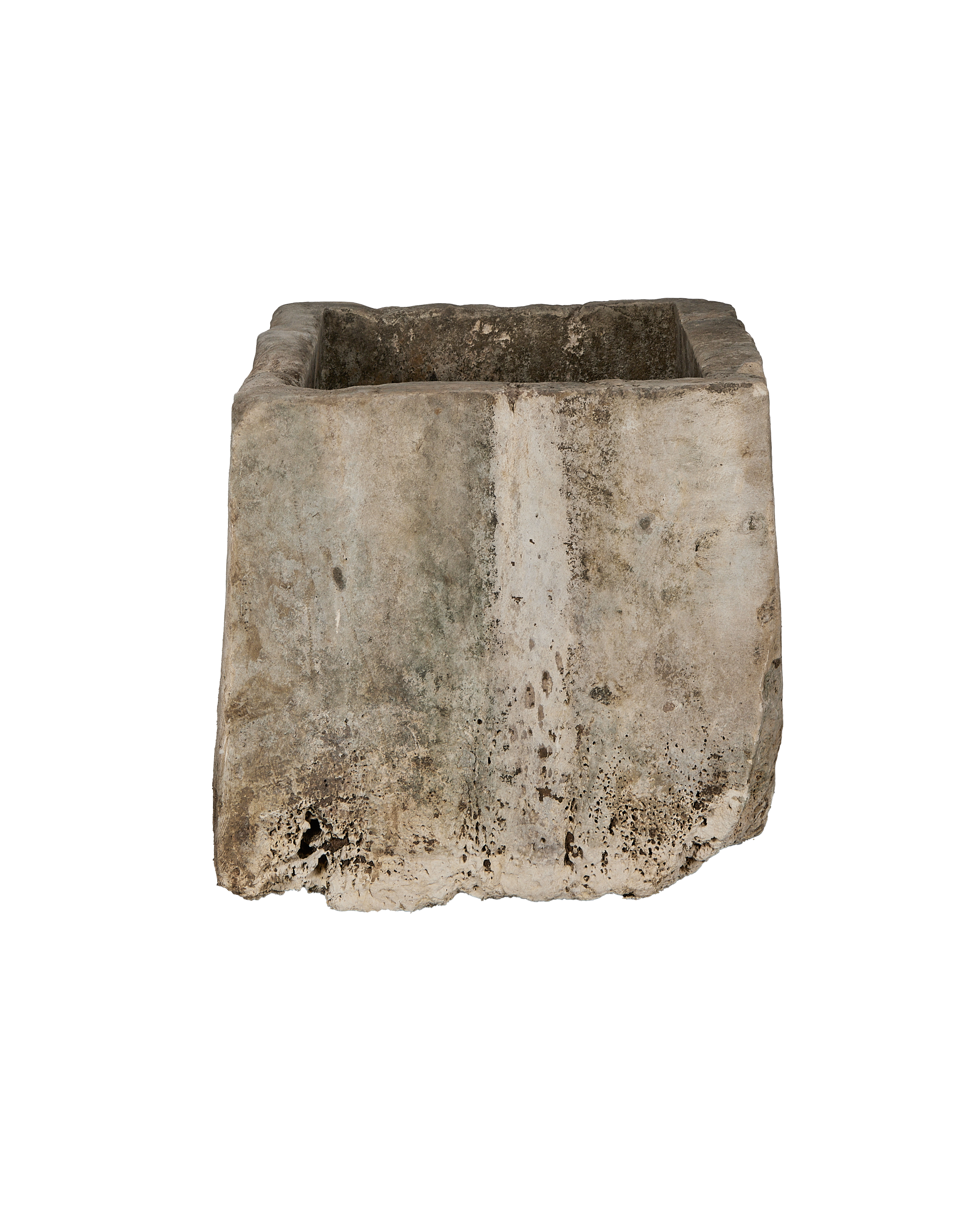Vintage Indonesian limestone trough, showing a side view of weathered texture and aged patination.