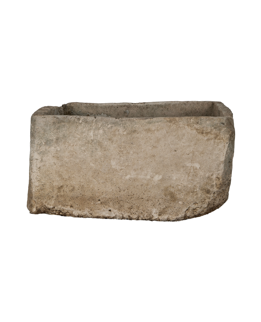 Vintage Indonesian rectangular limestone trough showcasing its worn, textured surface and aged edge.