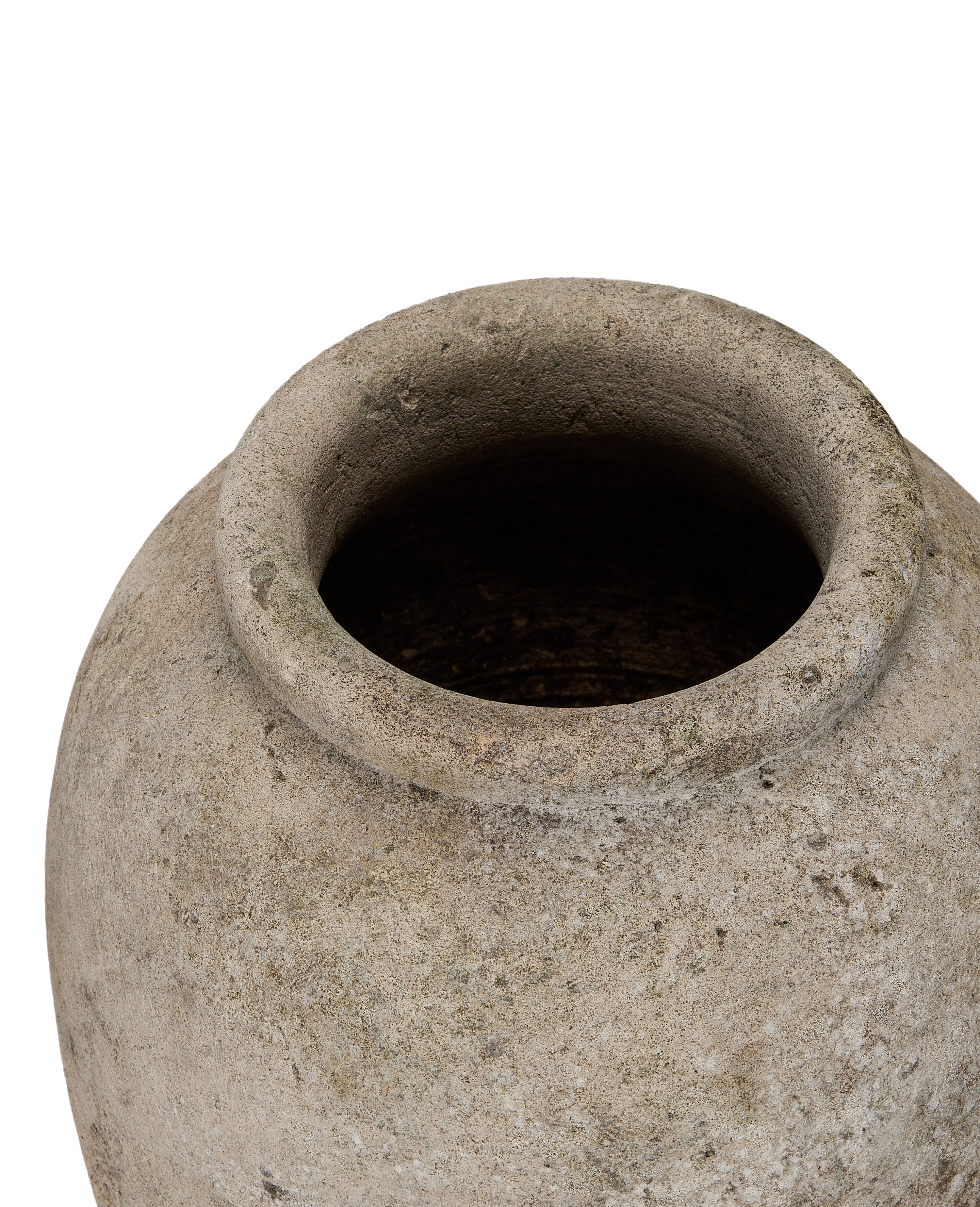 Vintage Indonesian stone vase, close-up of textured rim and weathered surface detail.