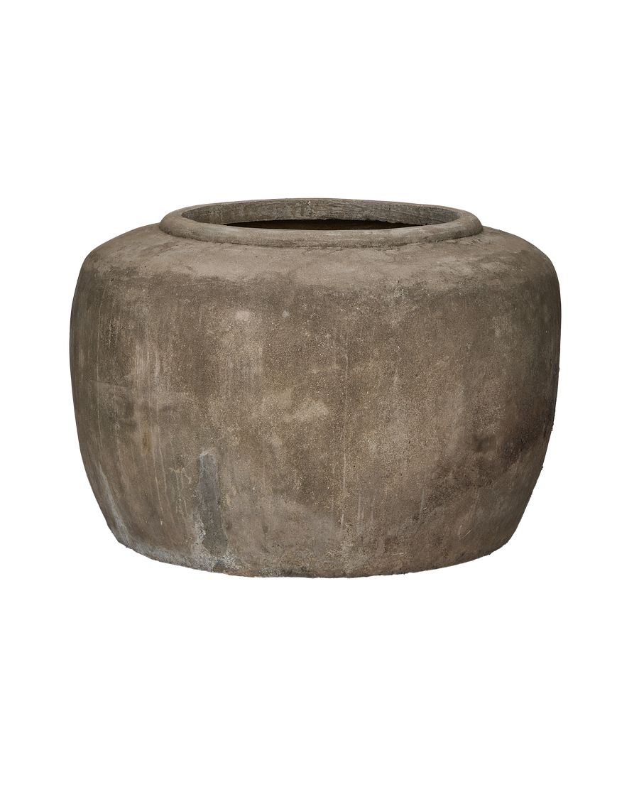Vintage Indonesian stone pot, full front view, showing textured surface with weathering.