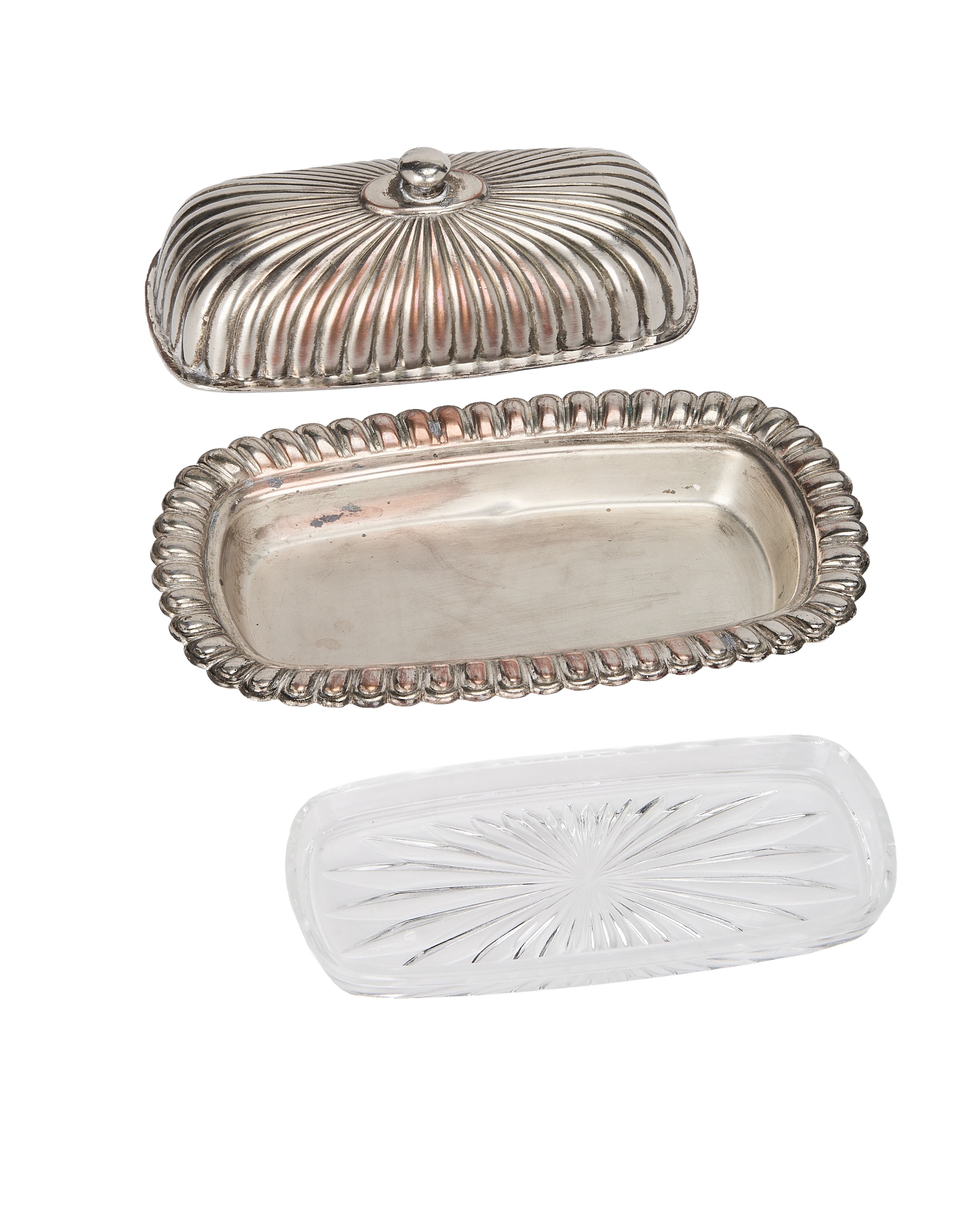 Vintage French corrugated butter dish components: ornate silver-plated cover, tray, and clear pressed glass insert.