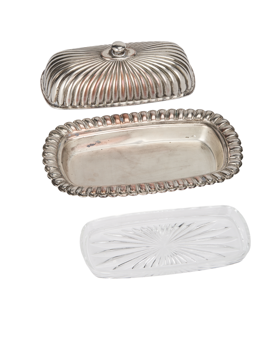 Vintage French corrugated butter dish components: ornate silver-plated cover, tray, and clear pressed glass insert.