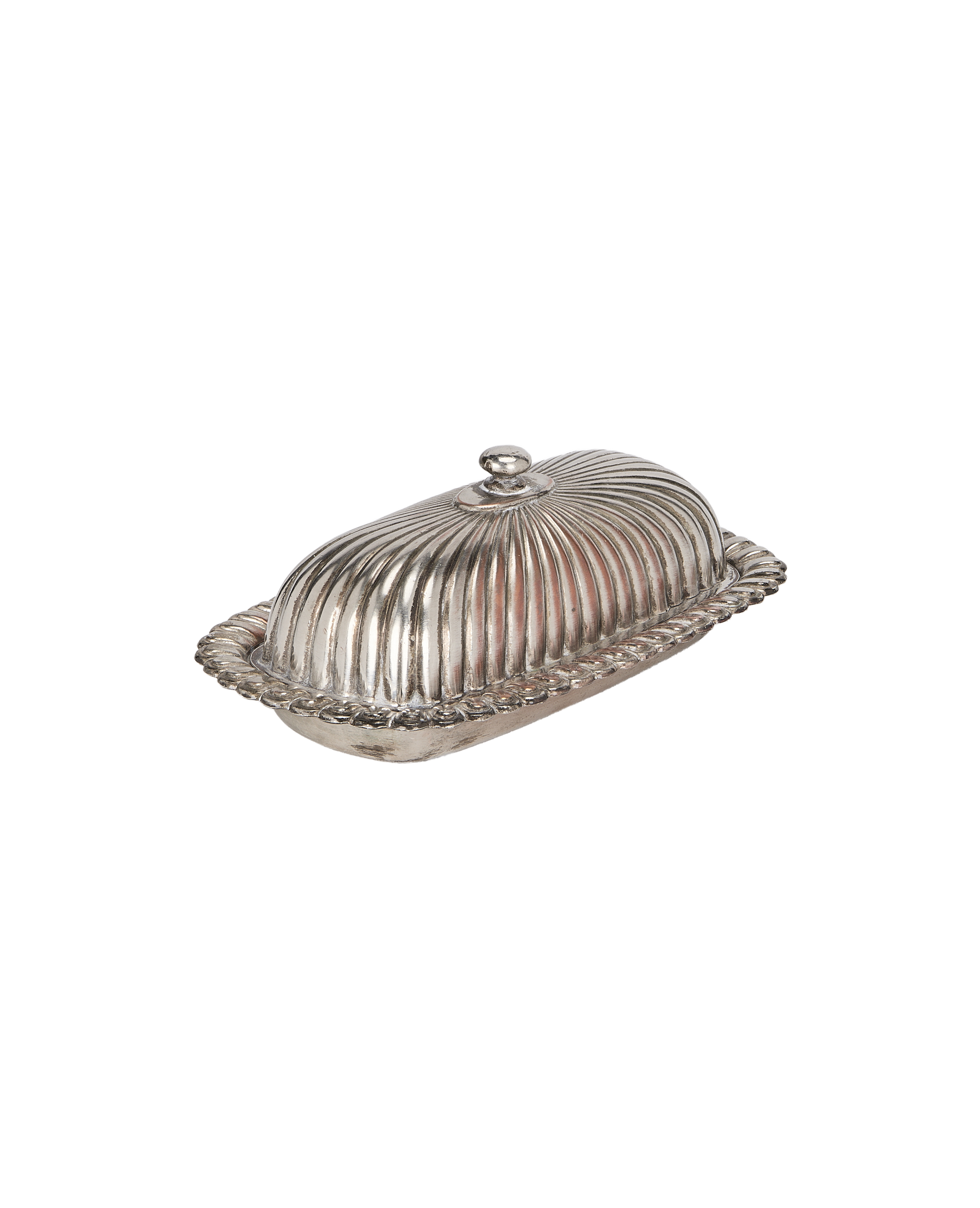 Vintage French corrugated silver butter dish from overhead, showcasing ornate rope trim.