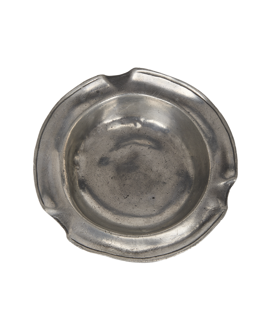 Vintage French pewter ashtray, top-down view revealing aged patina and cigarette rests.