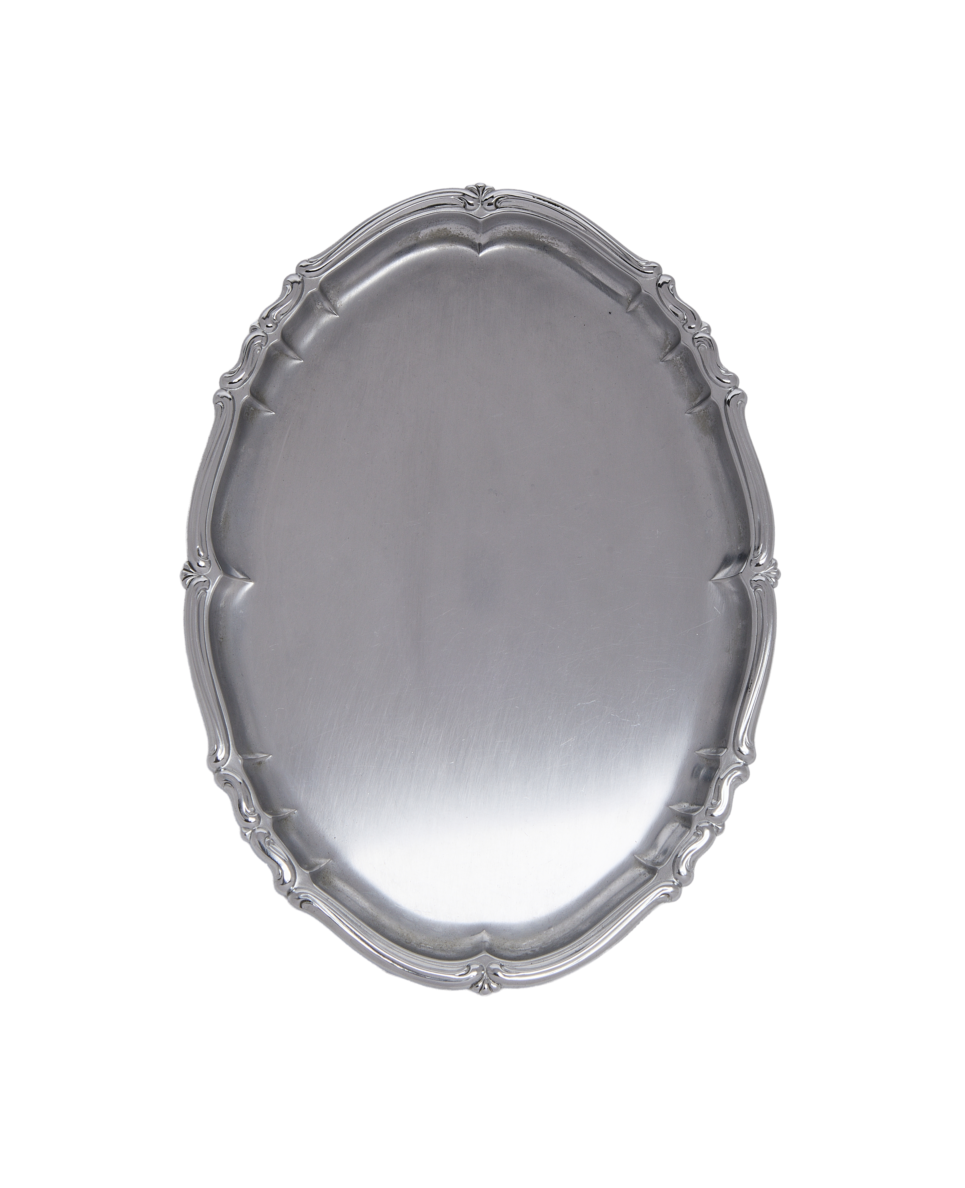 Vintage French metal serveware tray, showing full top view of ornate scalloped rim detail.