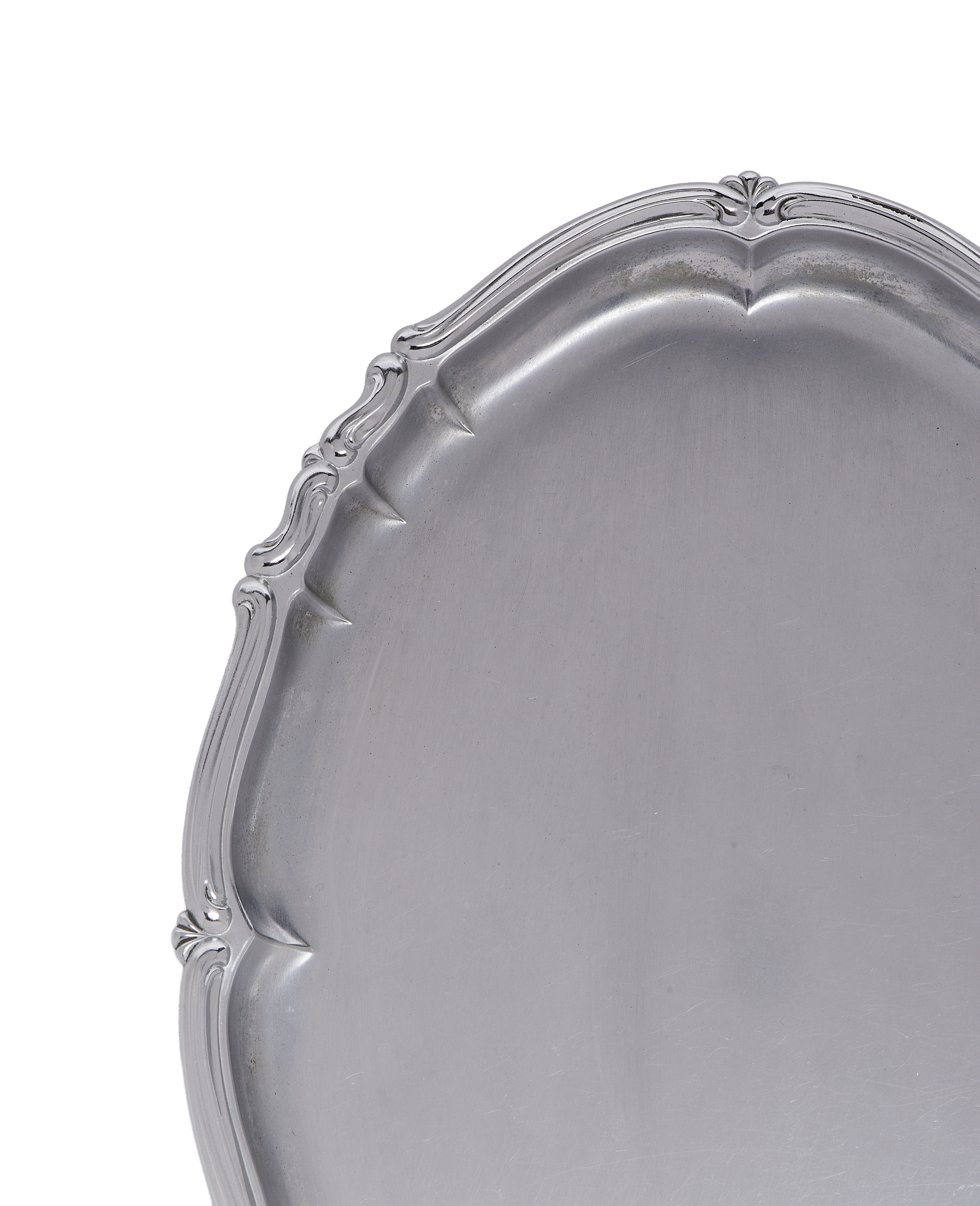 Vintage French silverplate serving tray, detailed close-up of decorative, ornate rim.