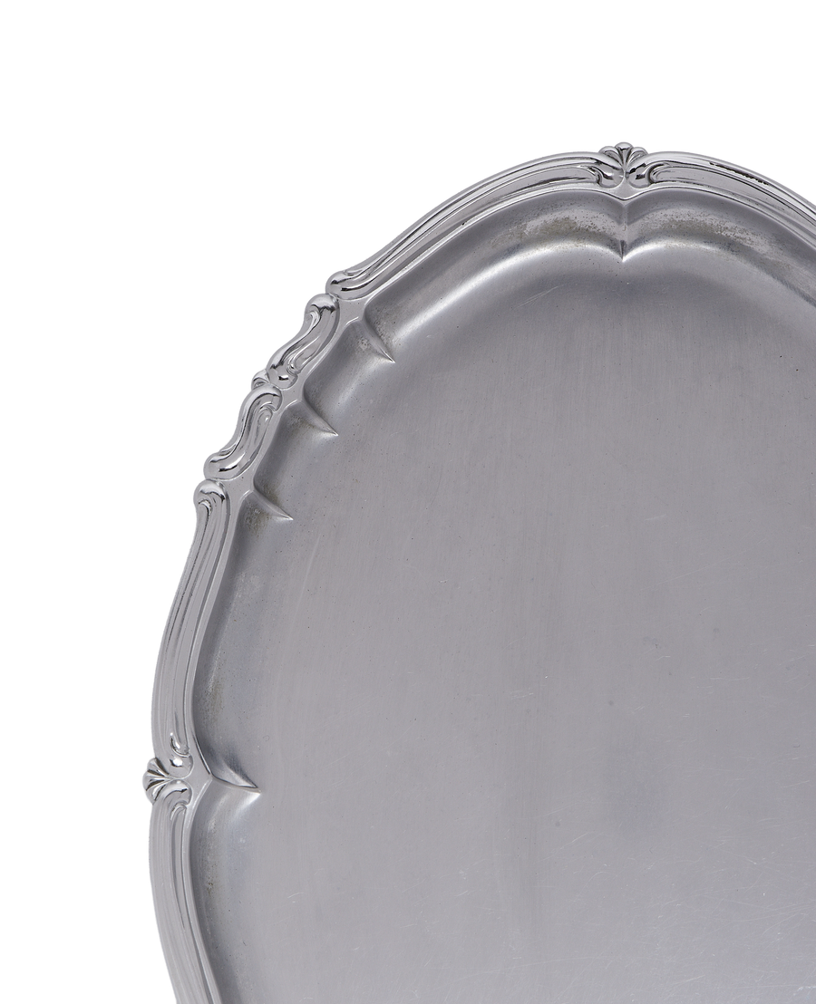 Vintage French silverplate serving tray, detailed close-up of decorative, ornate rim.