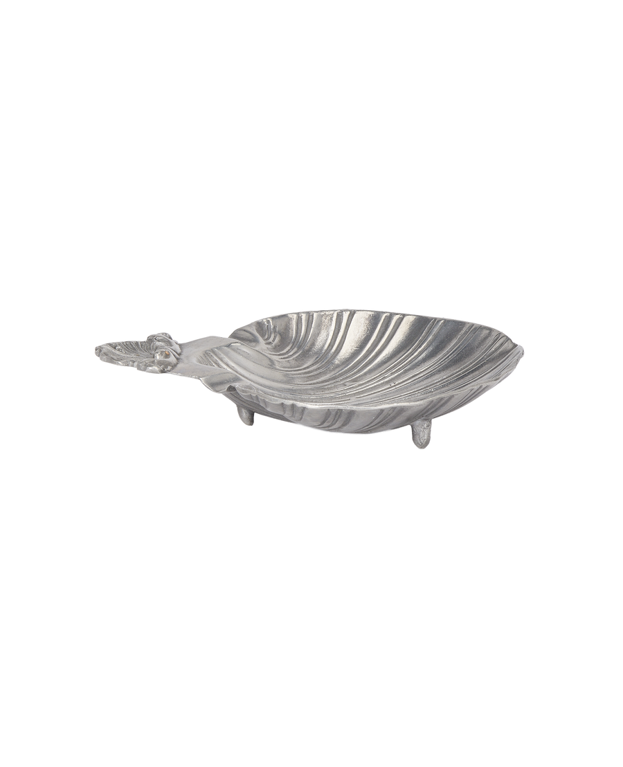Vintage French shell vide poche. This side view highlights its textured silver finish and footed base.