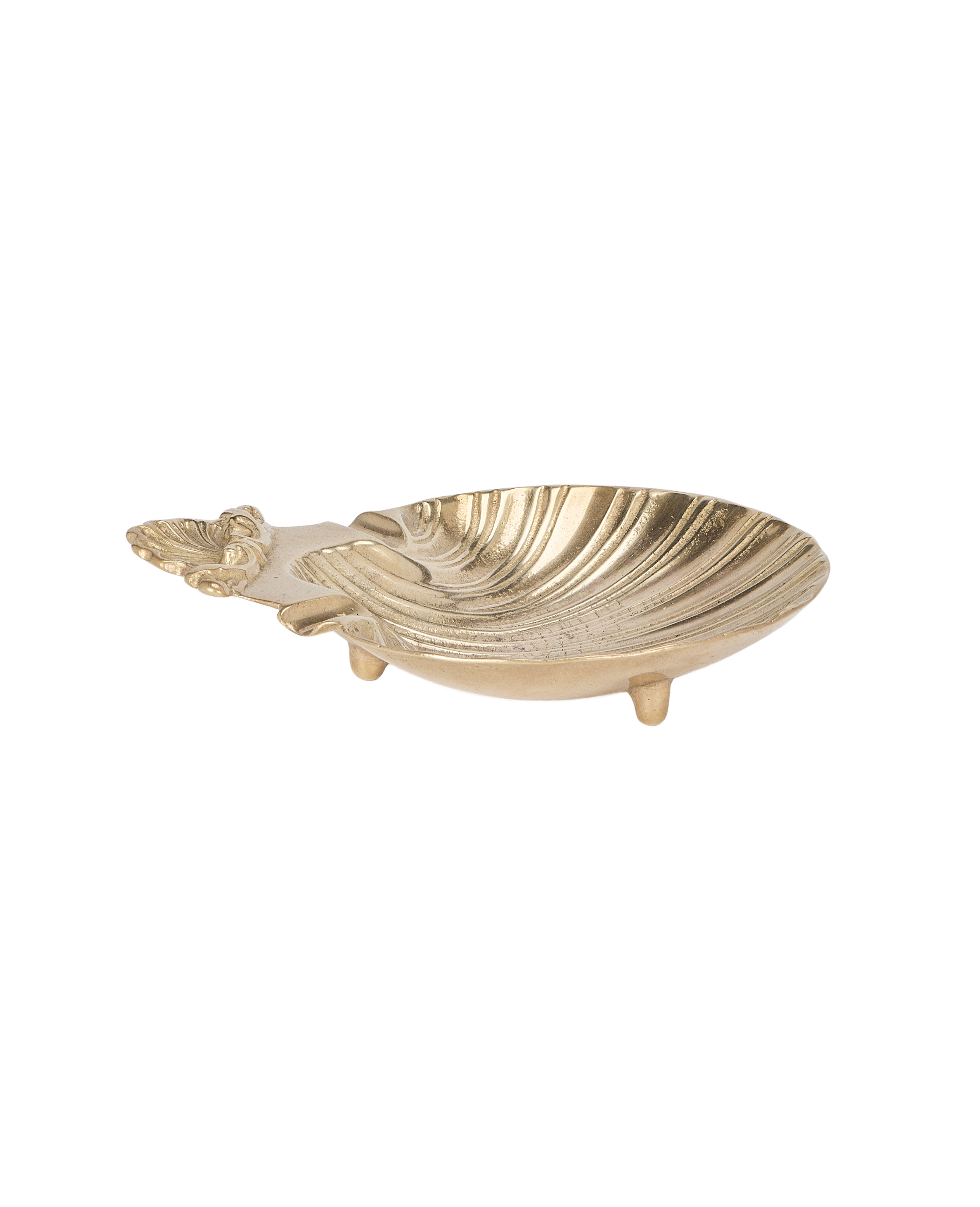 Vintage French brass shell vide poche, angled close-up revealing three sturdy feet.