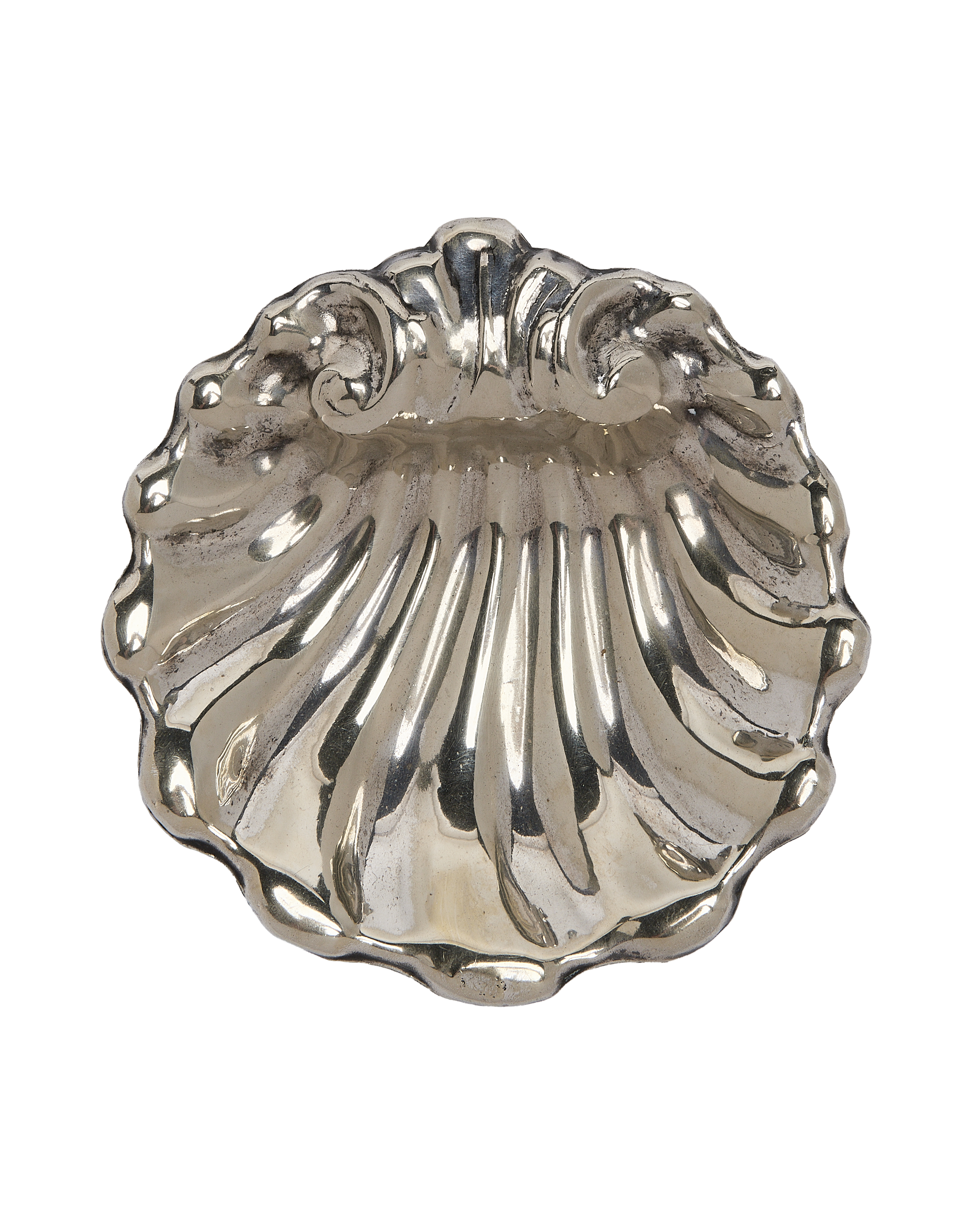 Vintage French silver plated vide poche, shell-shaped, showcasing aged patina and ornate detailing.
