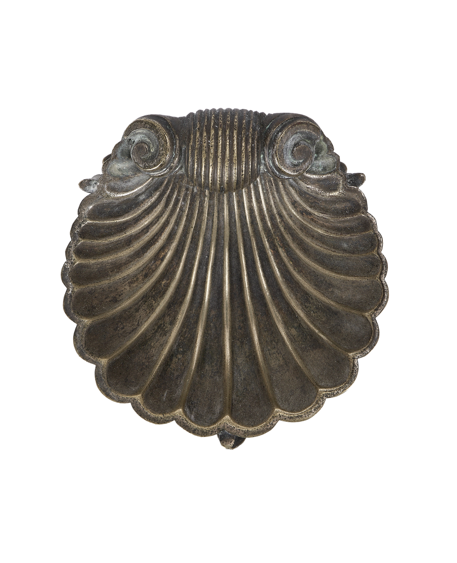 Vintage brass shell ashtray from France, showing ornate scrollwork and ribbed detailing.