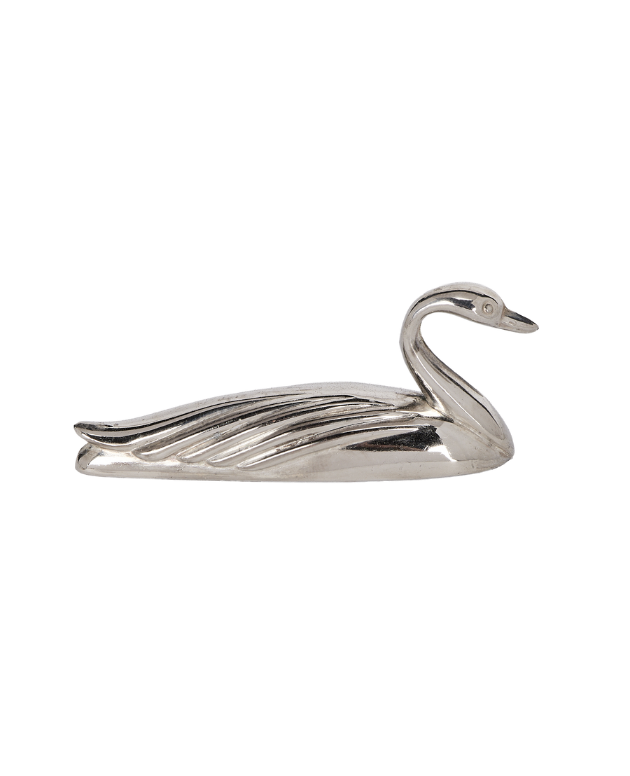 Close-up: Vintage French swan knife rest in shiny silver-plate, showing head and wing detail.