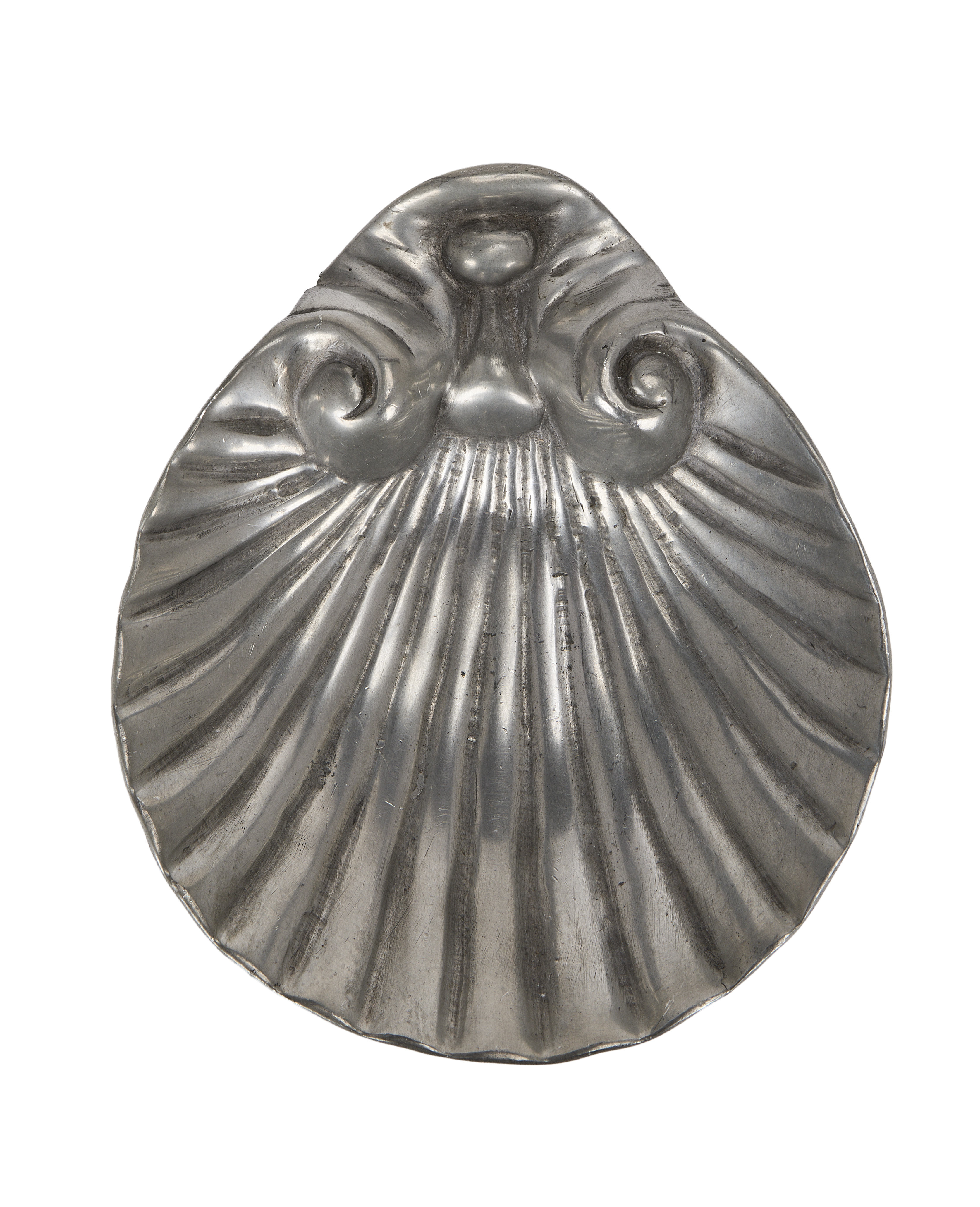Vintage French pewter vide poche, shell-shaped, showcasing ribbed details and aged texture.