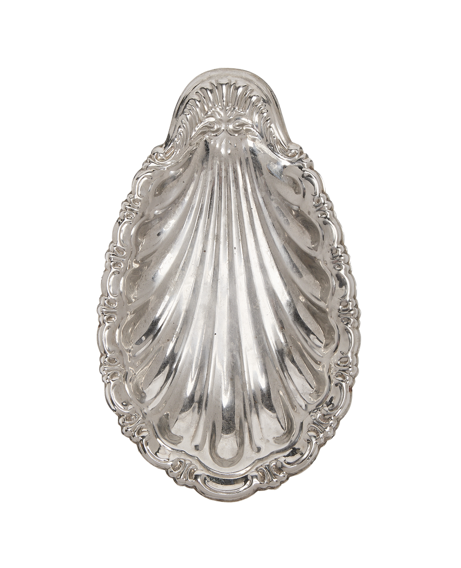 Vintage French silver vide poche detailed with shell fluting and ornate rococo rim.