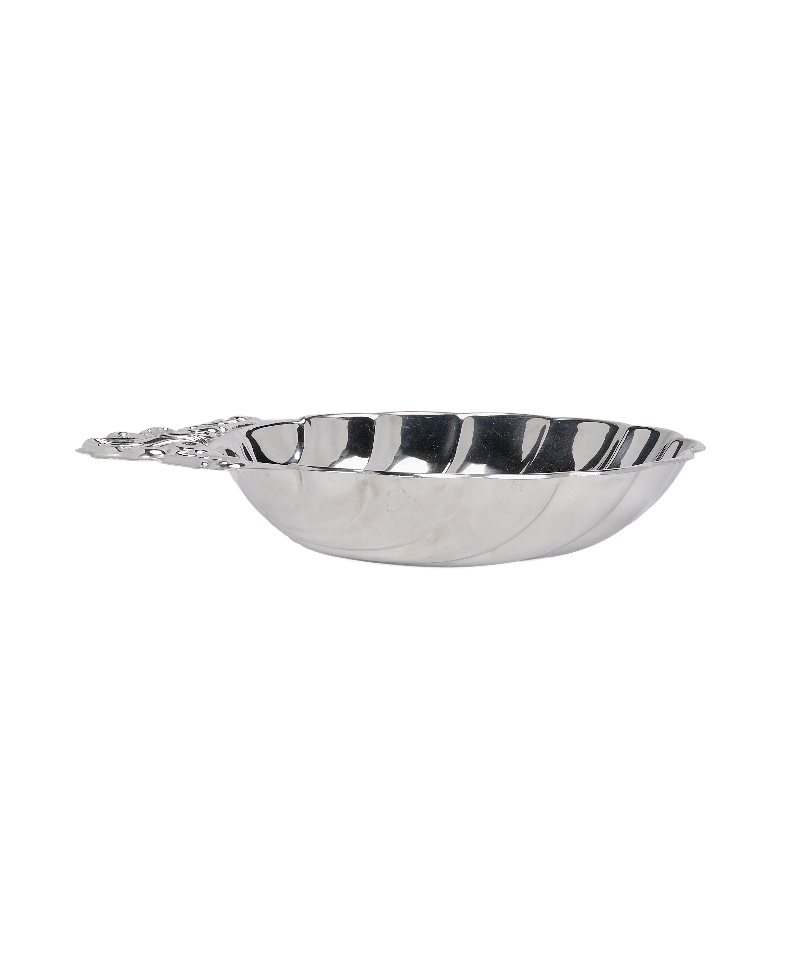 Vintage French shell steel dish, side view, showing detailed handle and corrugated edge.
