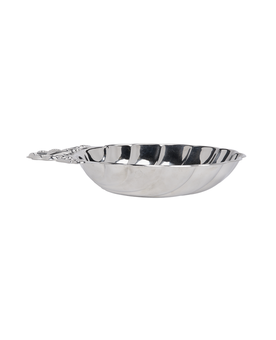 Vintage French shell steel dish, side view, showing detailed handle and corrugated edge.
