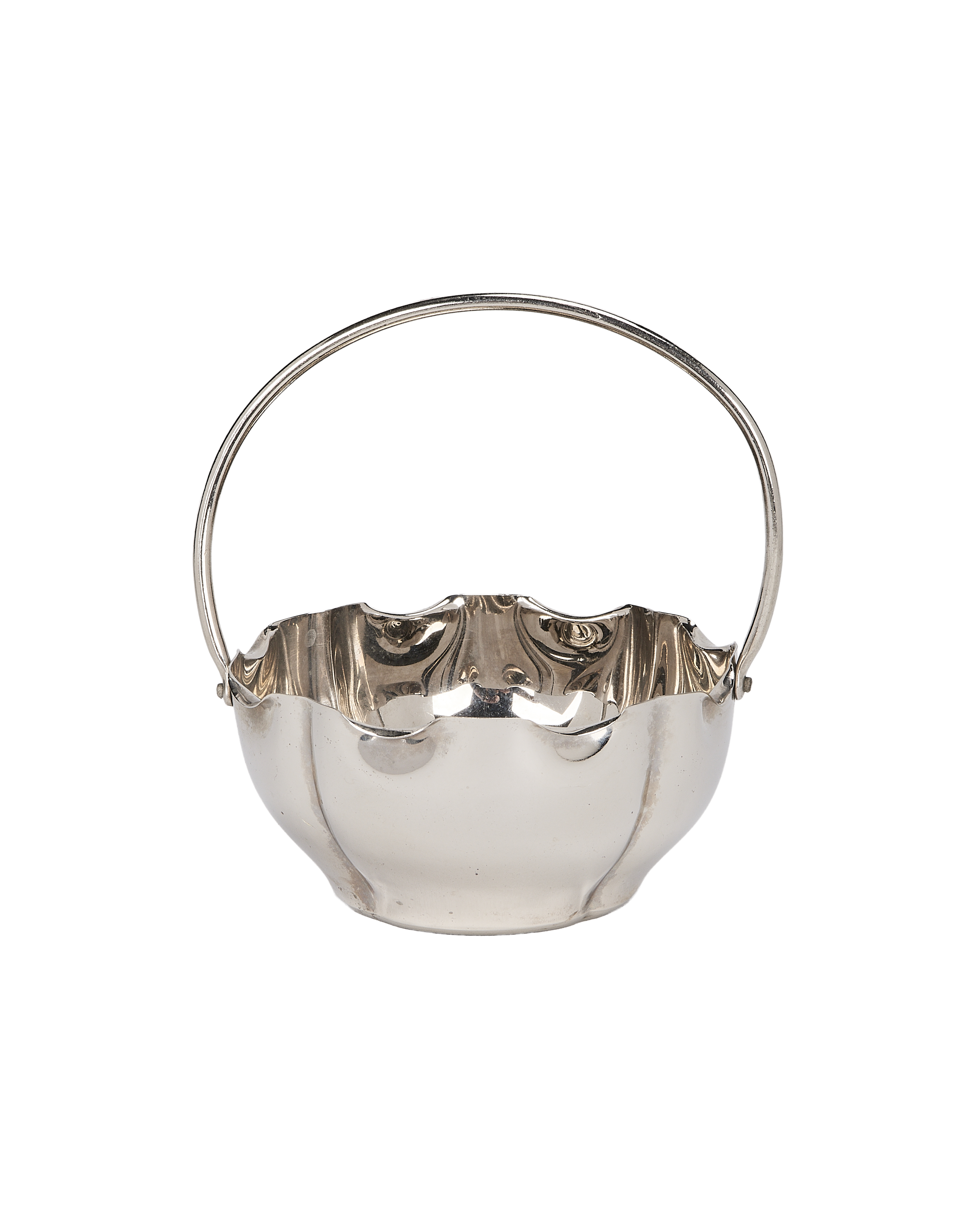 Vintage French silver plated holder with fluted rim and arched handle.