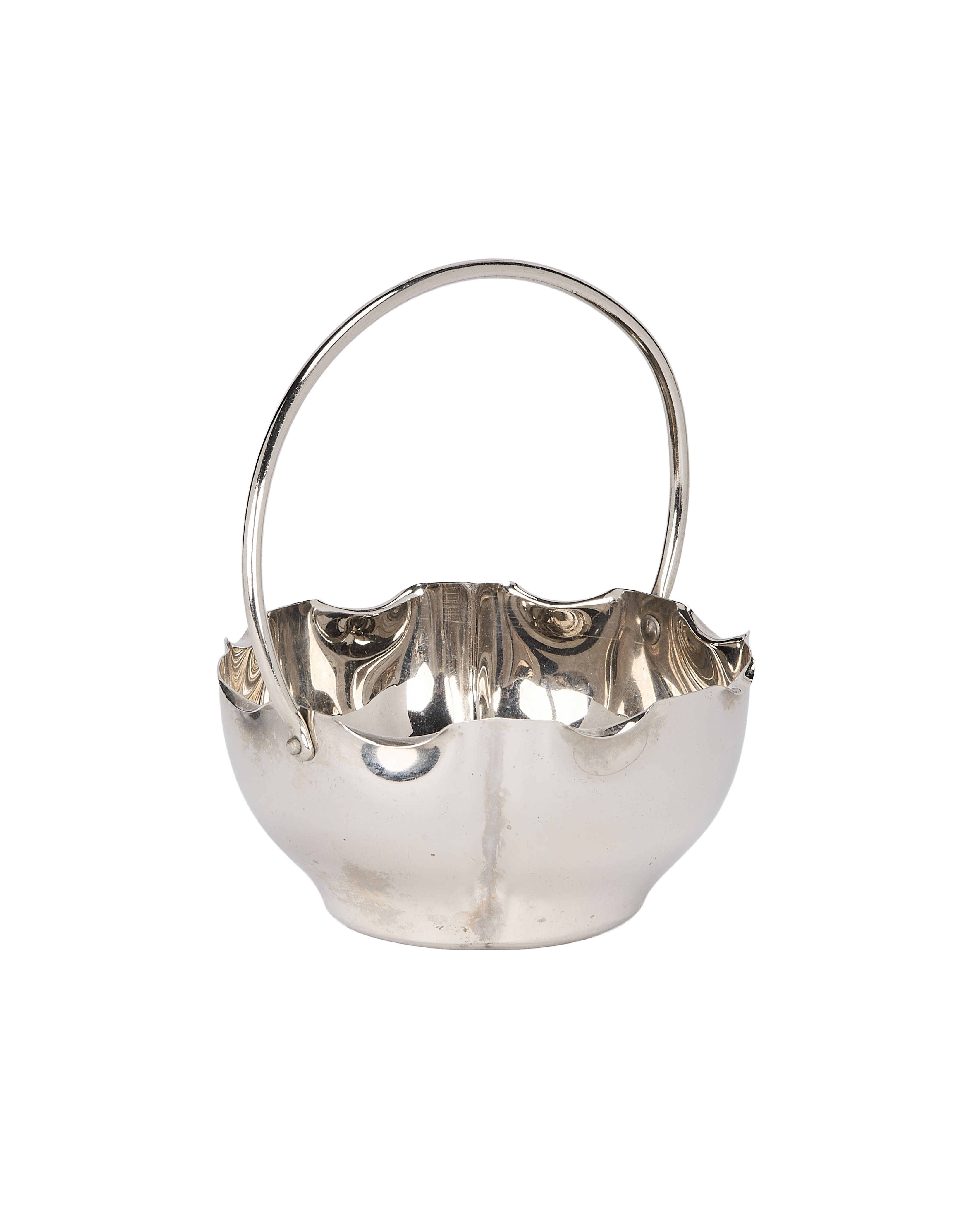 Vintage French silver-plated basket, showing fine patina, smooth handle connection, and wavy rim detail.