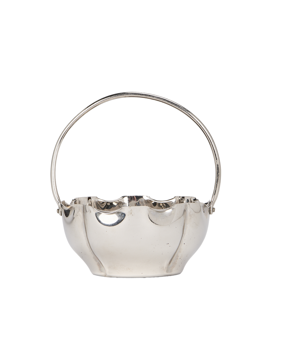 Vintage French silver-plated basket, side view detailing the classic curved handle.