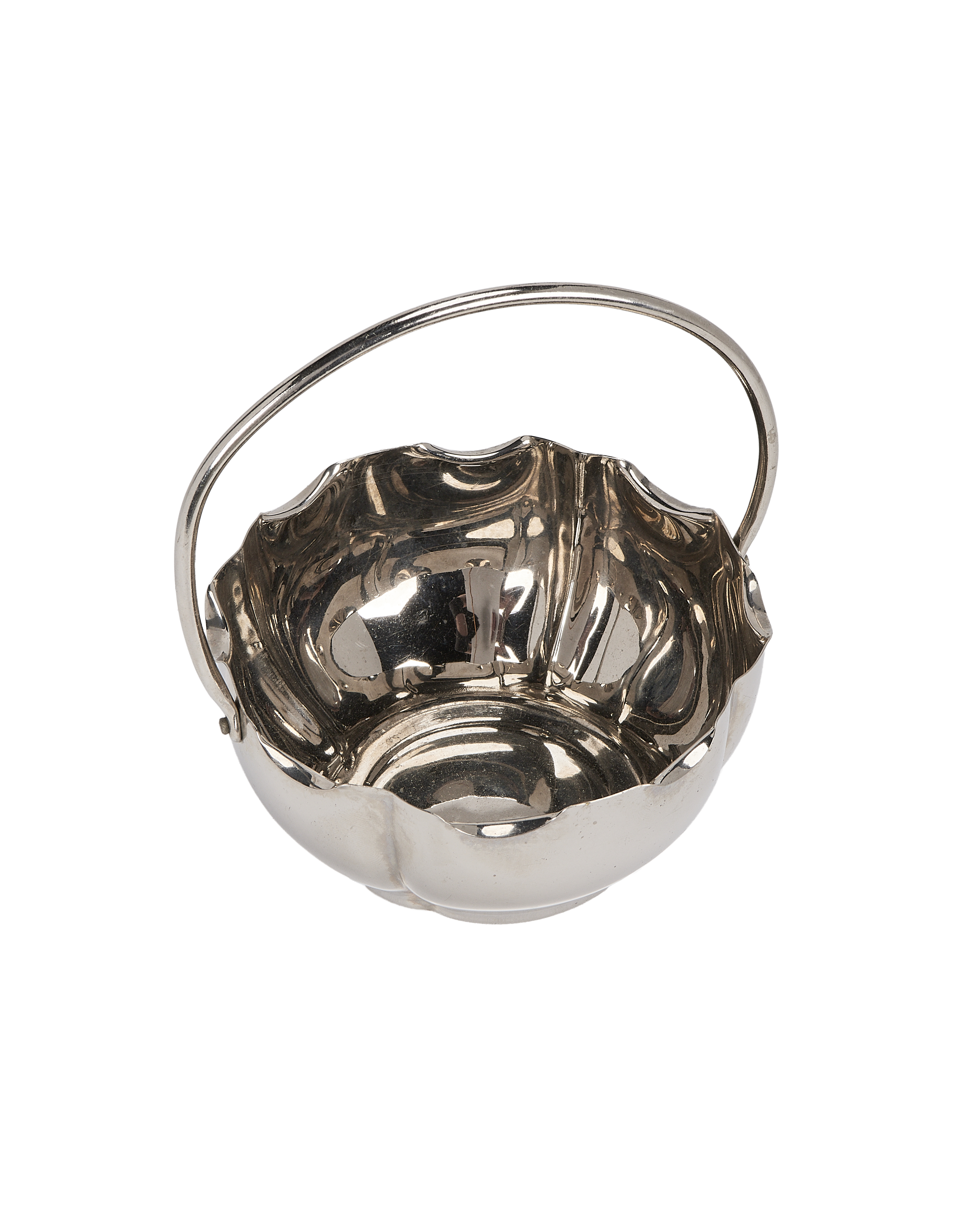 Vintage French silver-plated holder with swirled sides, showcasing reflective metallic luster and elegant handle.
