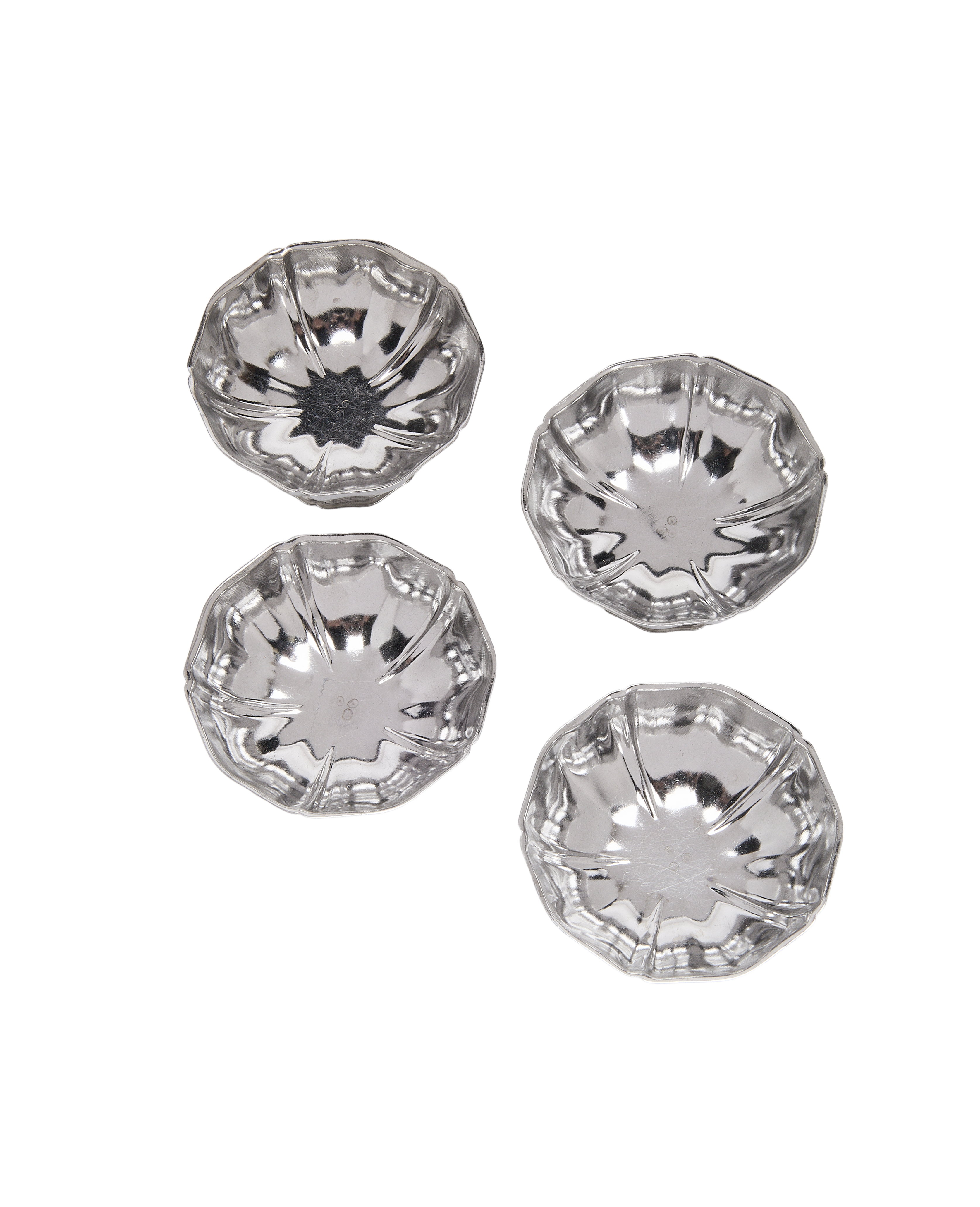Vintage French fluted steel cups, set of four, aerial view, reflective surface.