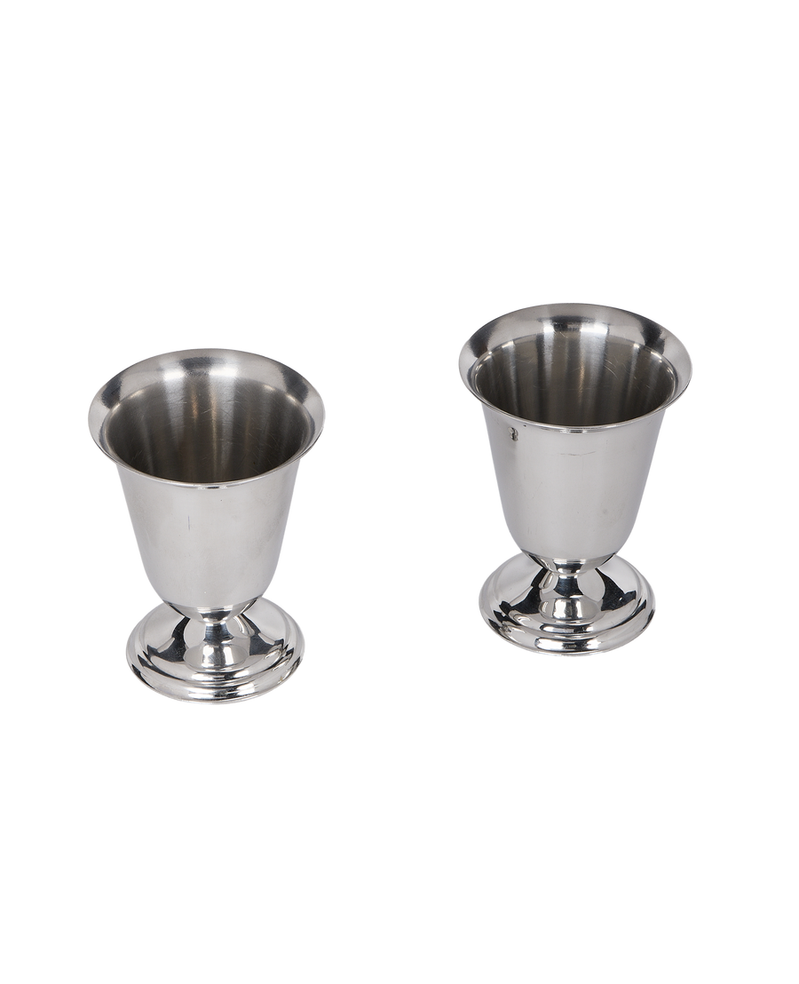 Pair of vintage French steel cups, showing overall form and footed bases.