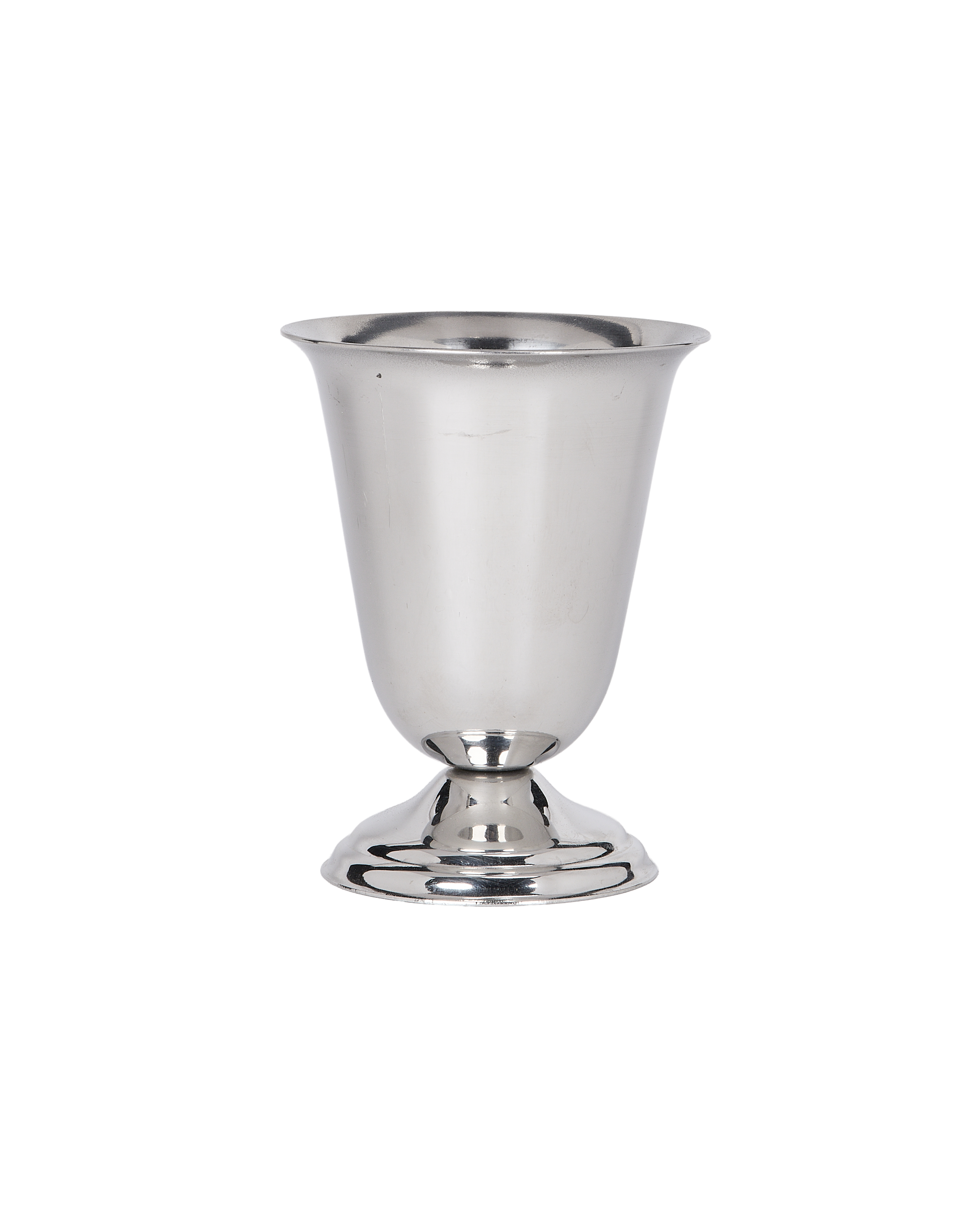 Vintage French steel cup details; close-up of fluted rim and polished base on black.