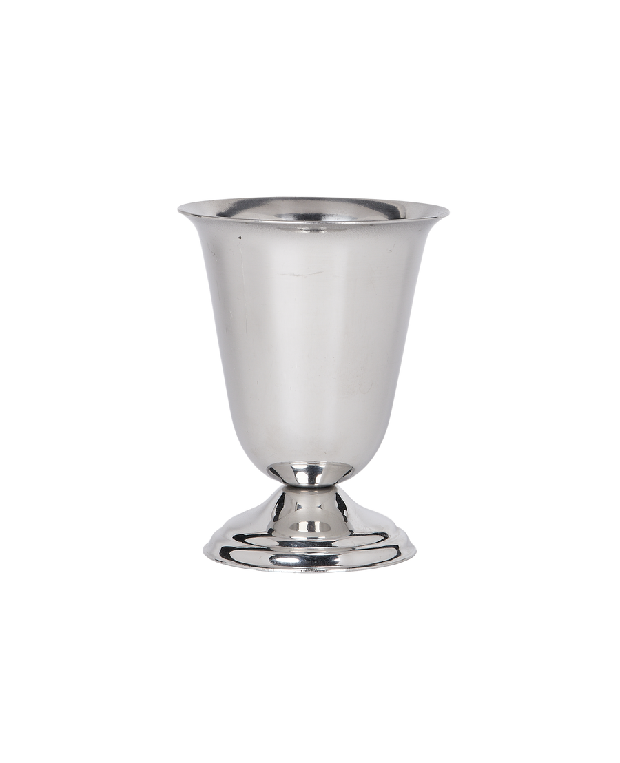 Vintage French steel cup details; close-up of fluted rim and polished base on black.