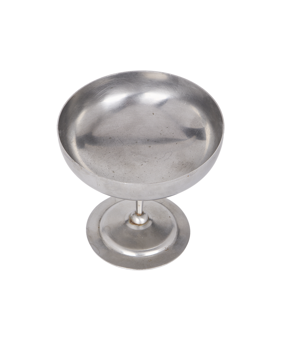 Vintage matte metal cup, slightly angled view, showing interior and pedestal base.