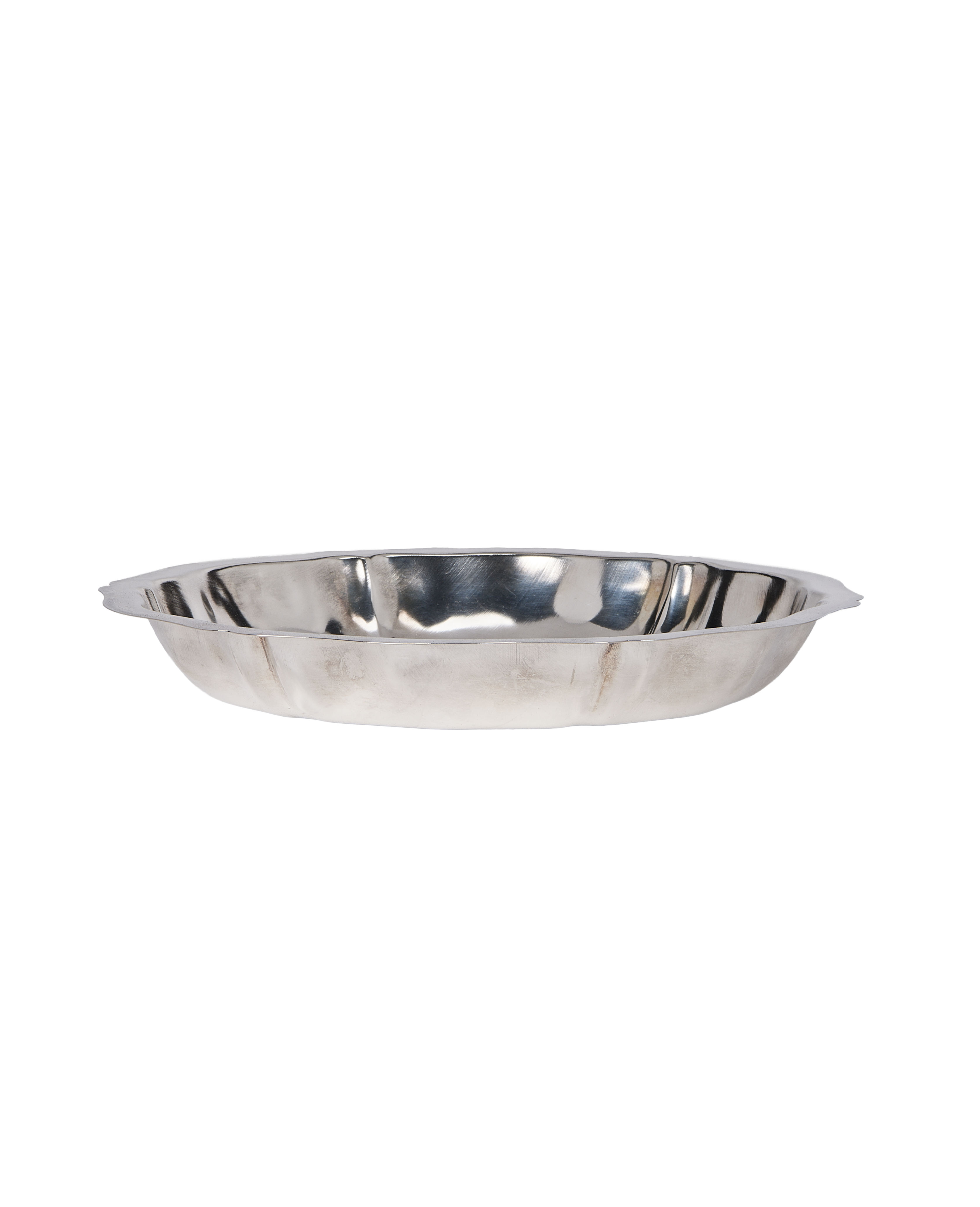 Vintage French metal serving dish, side profile view showing curved edges and handles.
