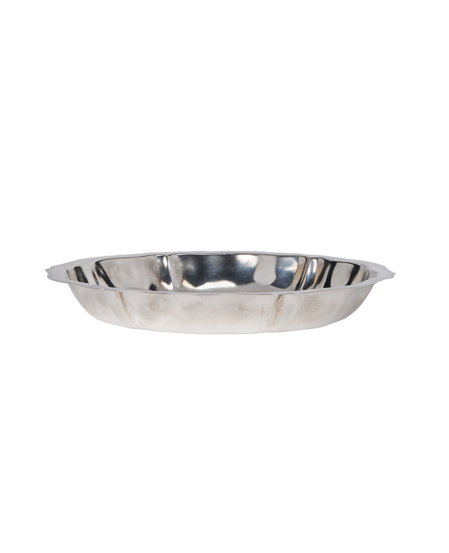 Vintage French metal serving dish, side profile view showing curved edges and handles.