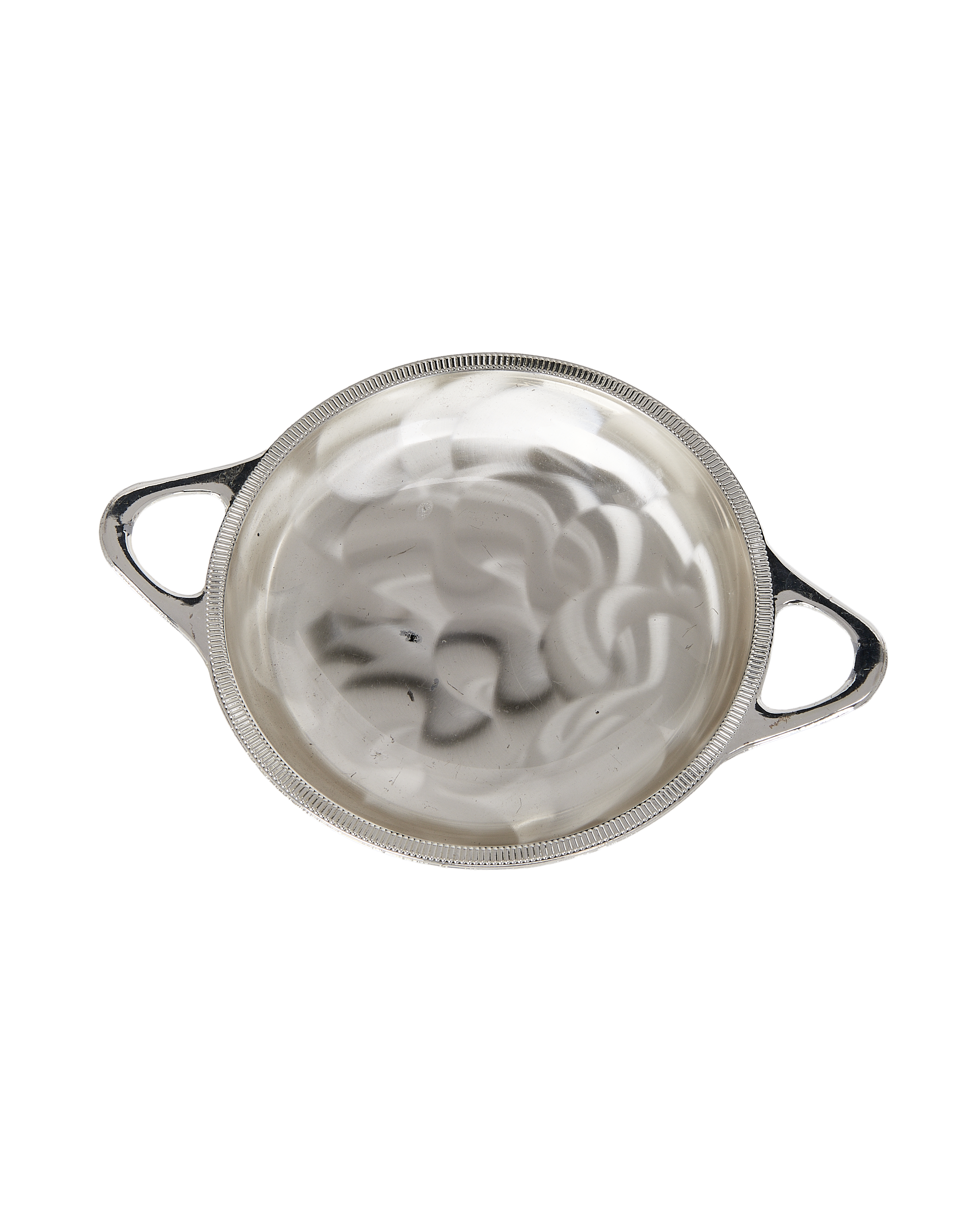 Vintage French pedestal dish, ornate silvery handles, shows bowl's shiny interior.