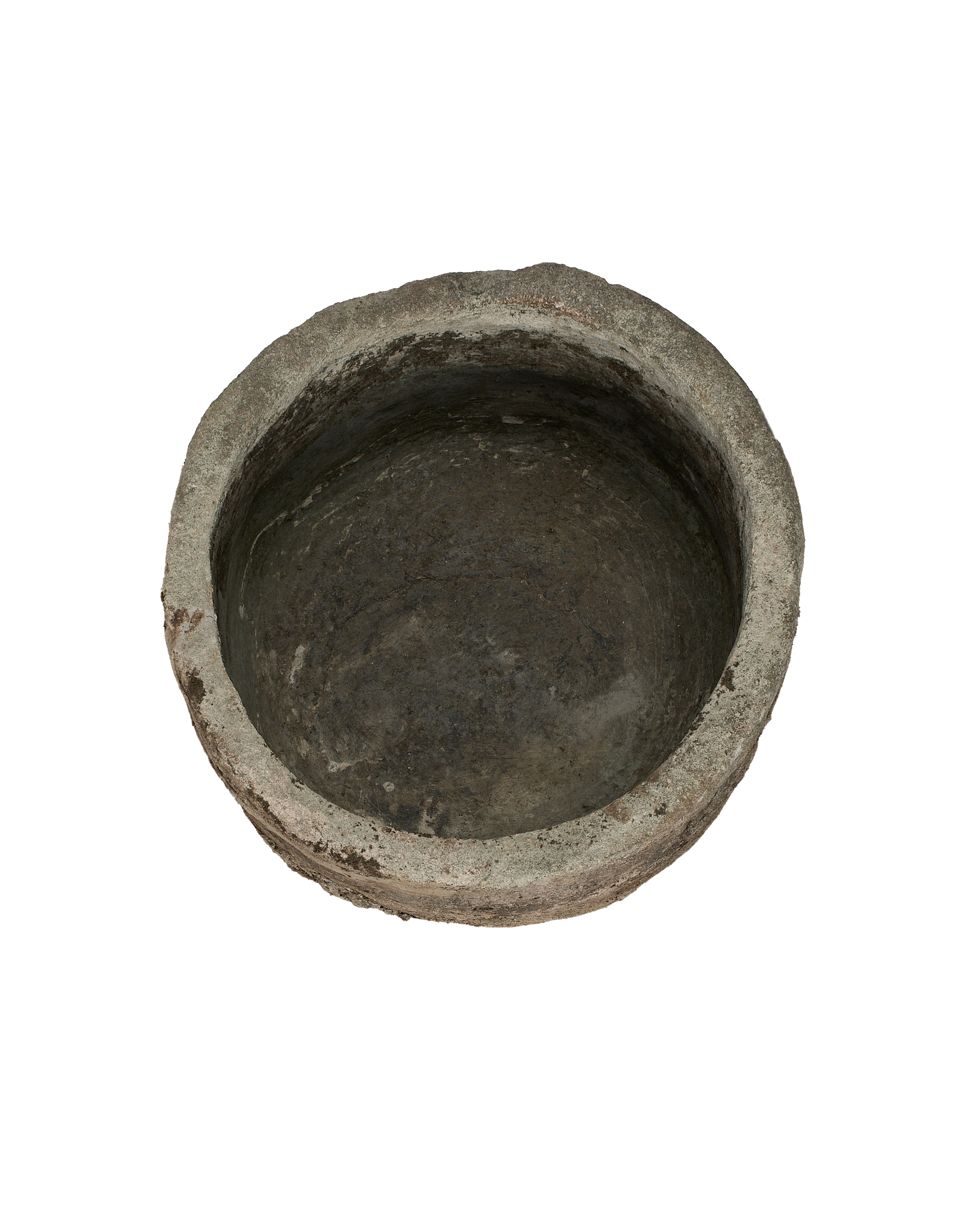 Vintage round limestone trough, top view emphasizing weathered texture and deep indentations.