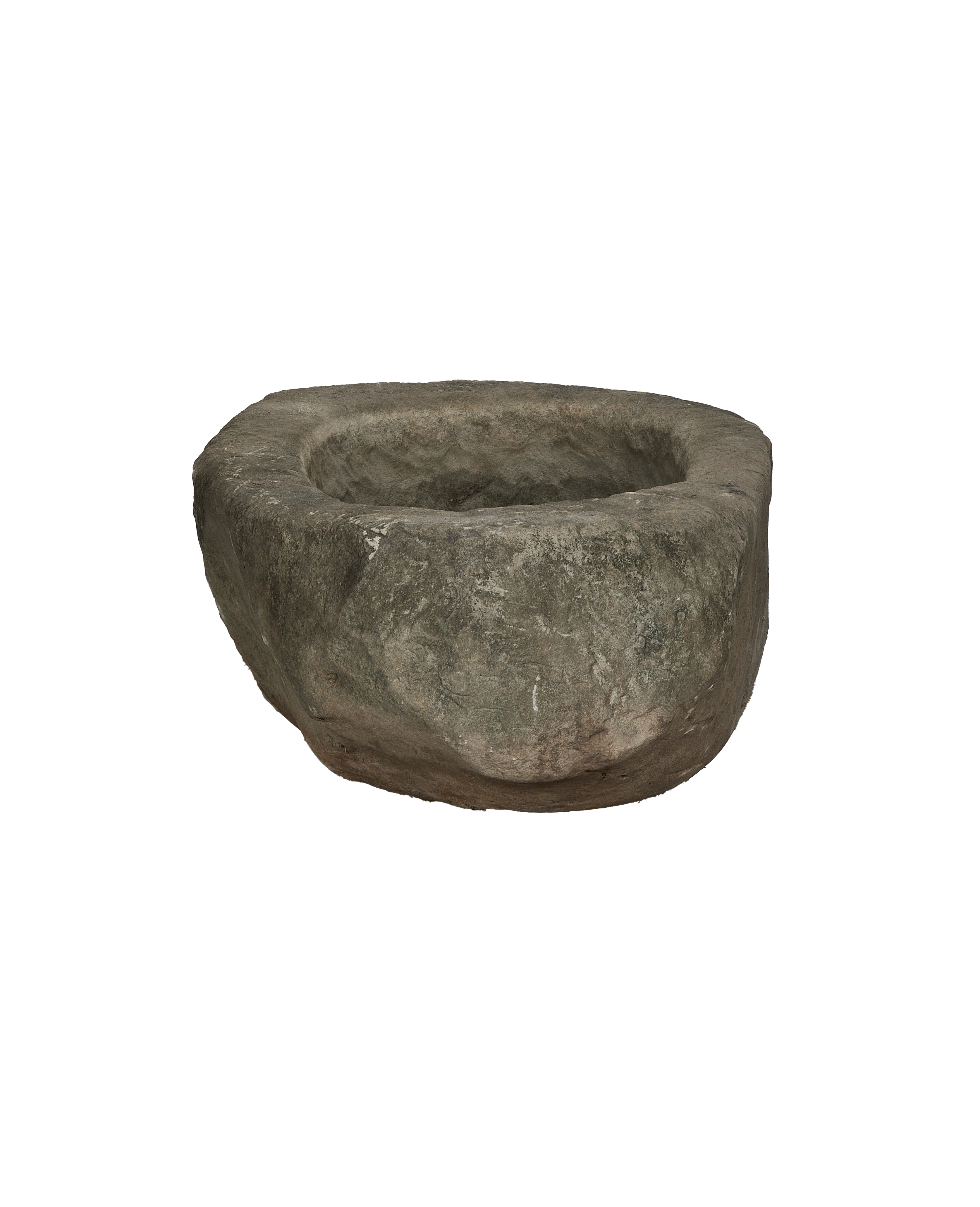 Vintage Indonesian limestone trough, top view revealing rough oblong interior and weathered exterior.