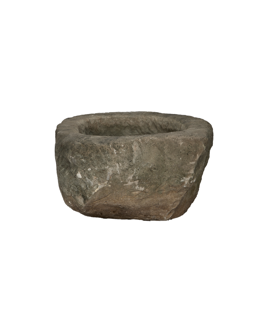 Vintage oblong limestone trough from Indonesia, showing its rough textured exterior and raw edges.