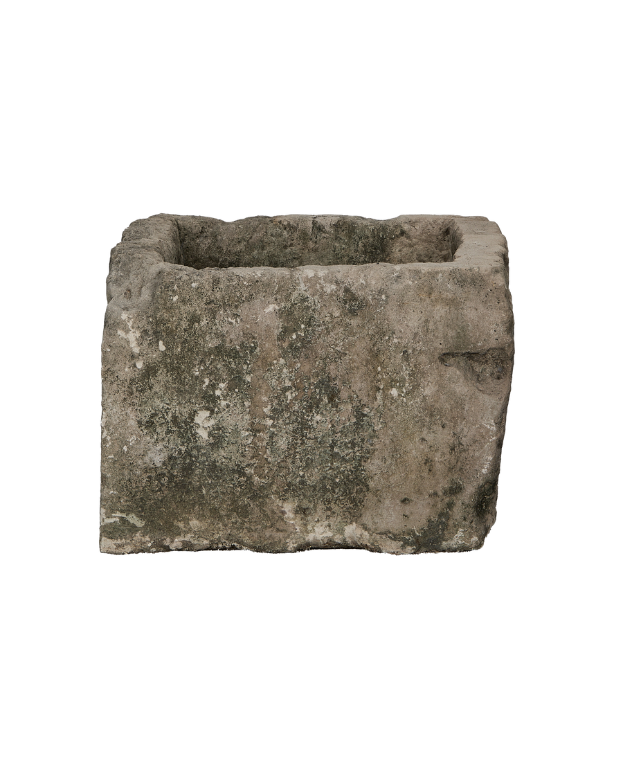 Vintage Indonesian rectangular limestone trough showing detailed weathered lichen and rough-hewn texture.