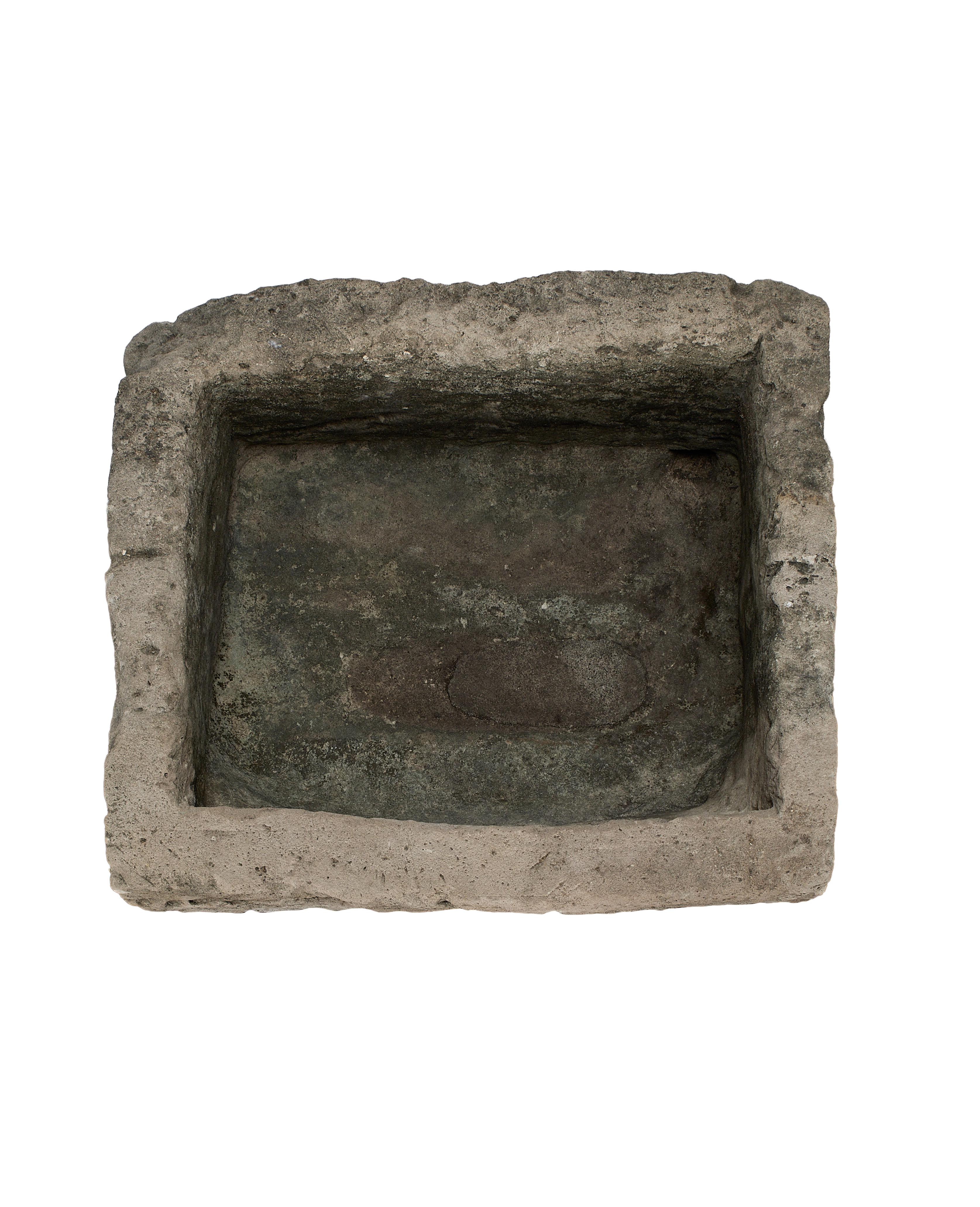 Vintage rectangular limestone trough, top view reveals rustic interior and textured edges.