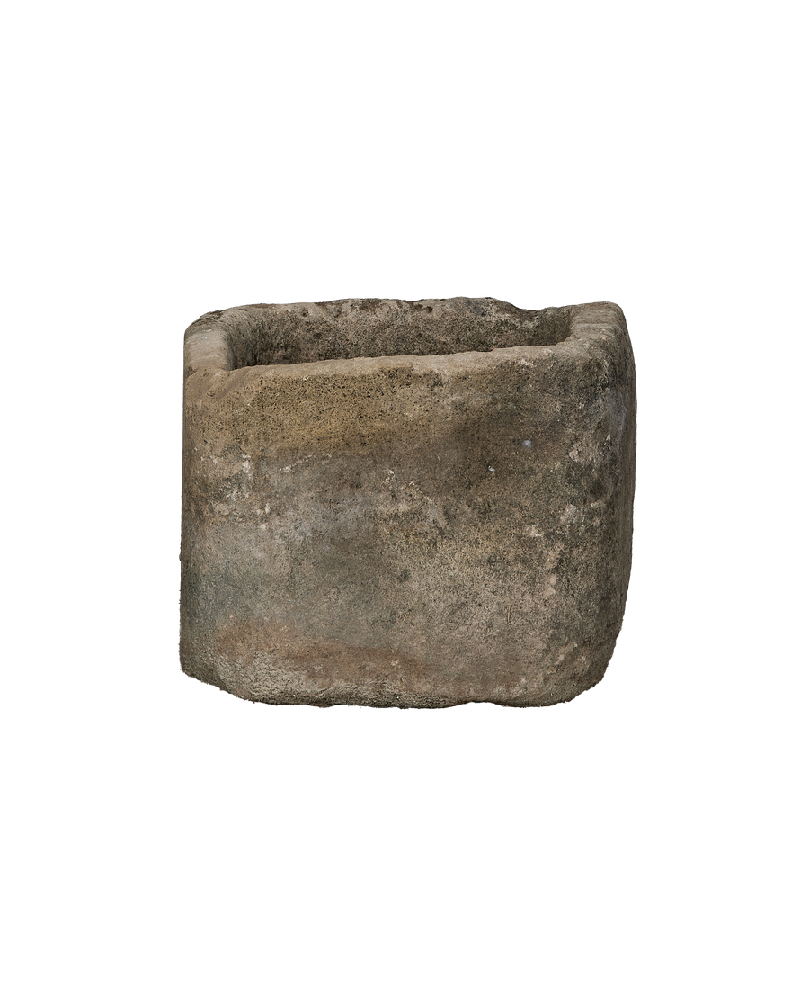 Vintage Indonesian oblong limestone trough viewed from its weathered side.