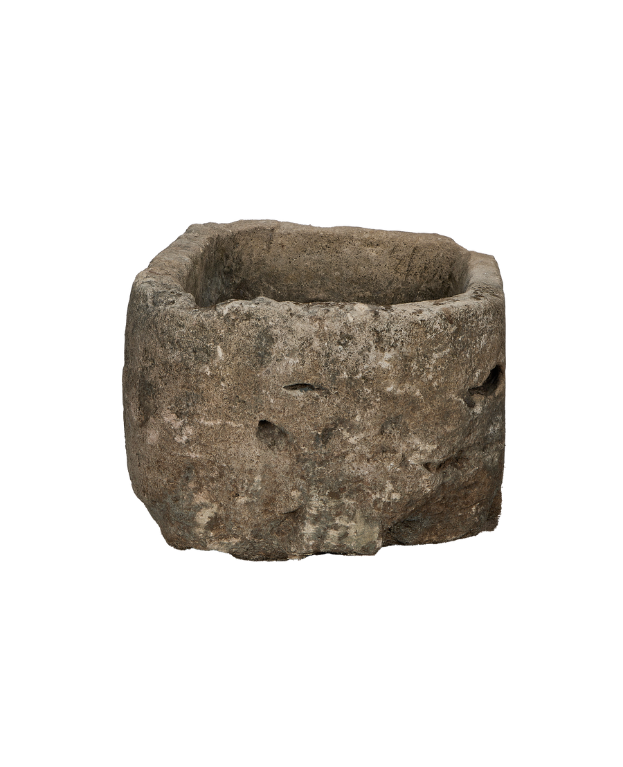 Vintage Indonesian limestone trough, displaying natural rough texture and weathered oblong shape from above.
