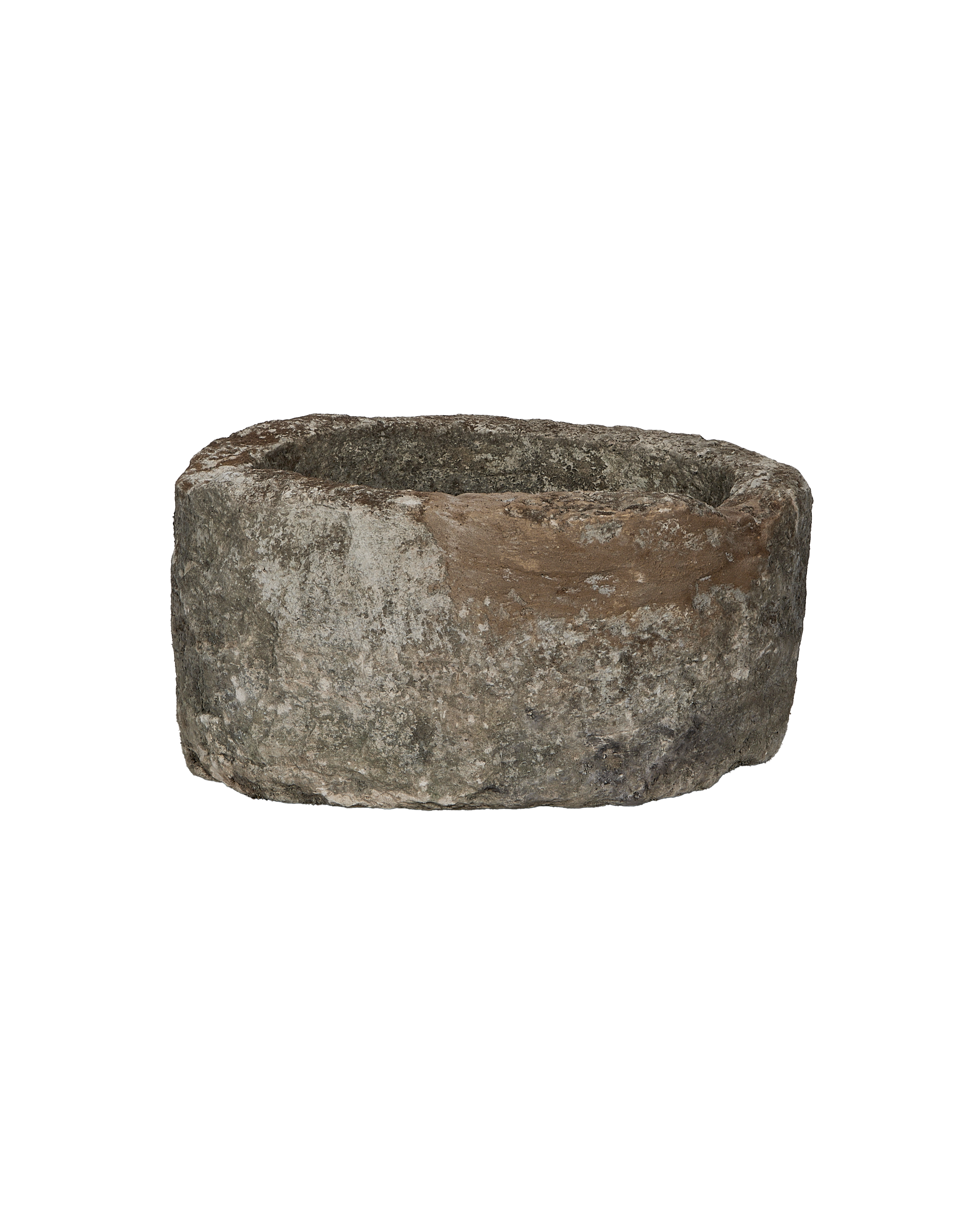 Vintage Indonesian round limestone trough, close-up of rough textured surface and weathered rim.