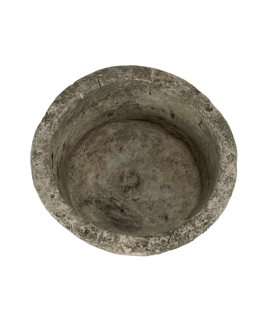 Vintage Indonesian round limestone trough, top-down view showing interior basin texture.