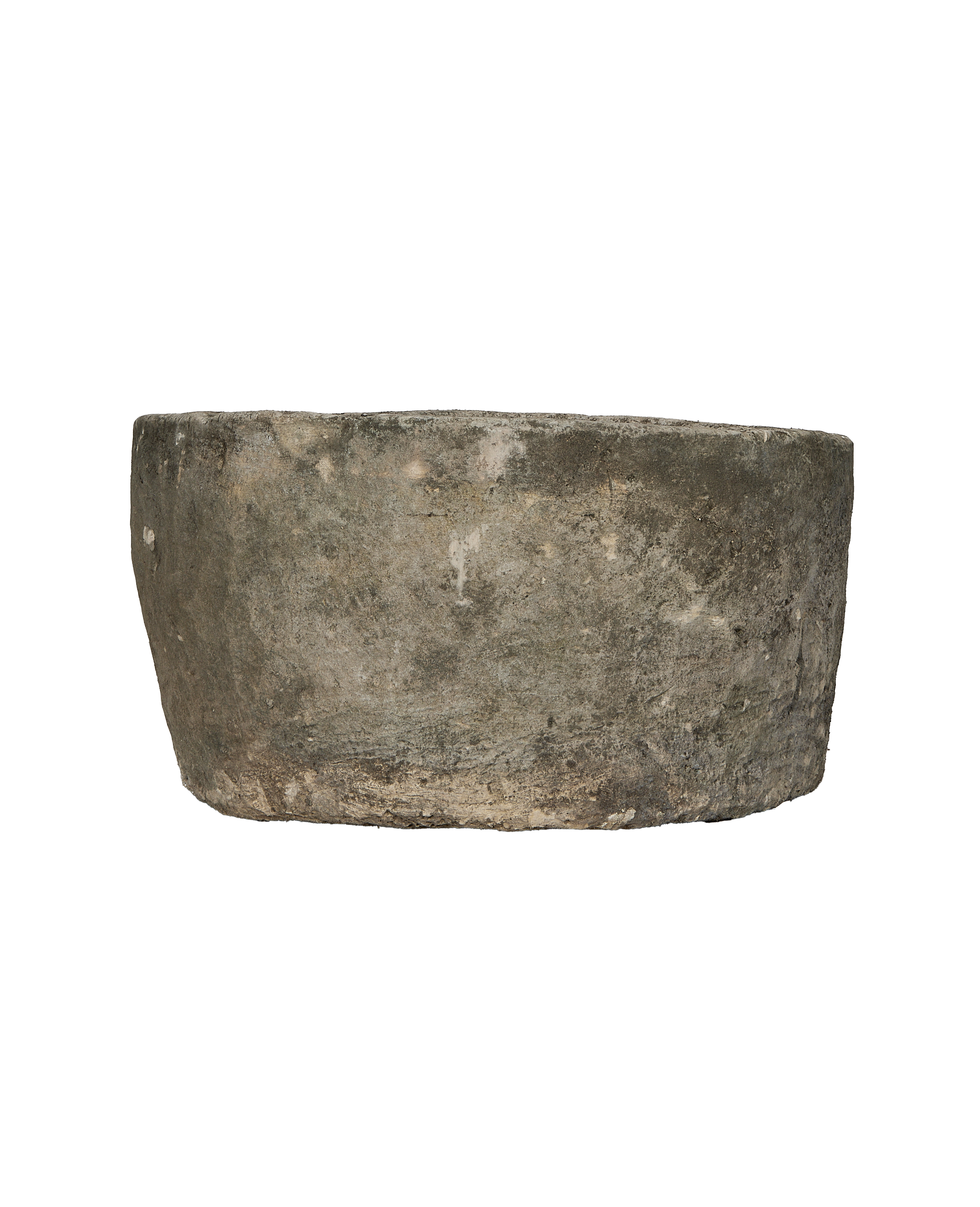 Vintage Indonesian round limestone trough, side profile, showcasing weathered texture.